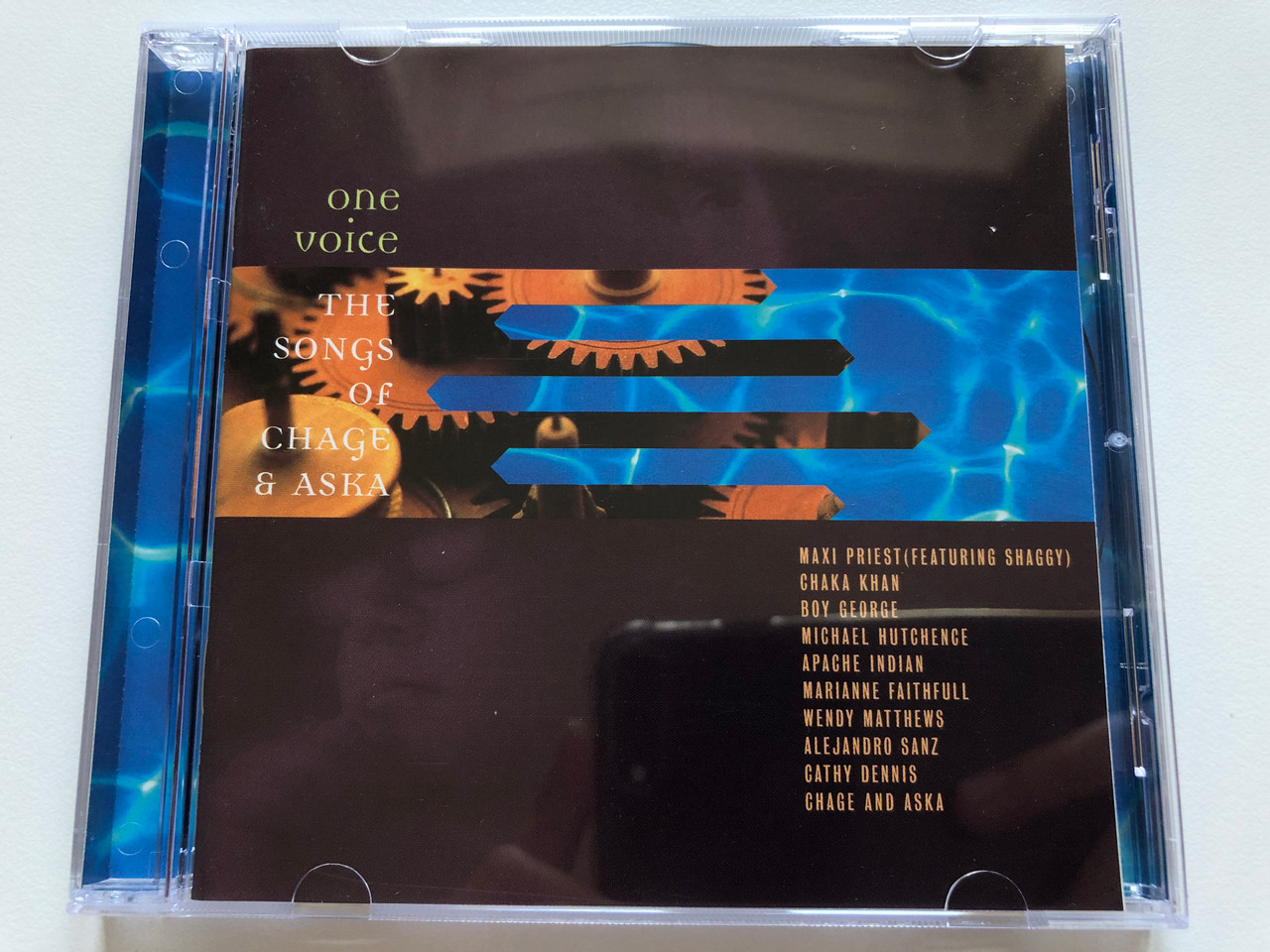 https://cdn10.bigcommerce.com/s-62bdpkt7pb/products/0/images/211072/One_Voice_The_Songs_Of_Chage_Aska_Maxi_Priest_featuring_Shaggy_Chaka_Khan_Boy_George_Michael_Hutchence_Apache_Indian_Marianne_Faithfull_Wendy_Matthews_Alejandro_Sanz_Cathy_Denni_1__13964.1643793737.1280.1280.JPG?c=2&_gl=1*r522k2*_ga*MjA2NTIxMjE2MC4xNTkwNTEyNTMy*_ga_WS2VZYPC6G*MTY0Mzc4MTAzOS4yODIuMS4xNjQzNzkzNDAyLjQ5