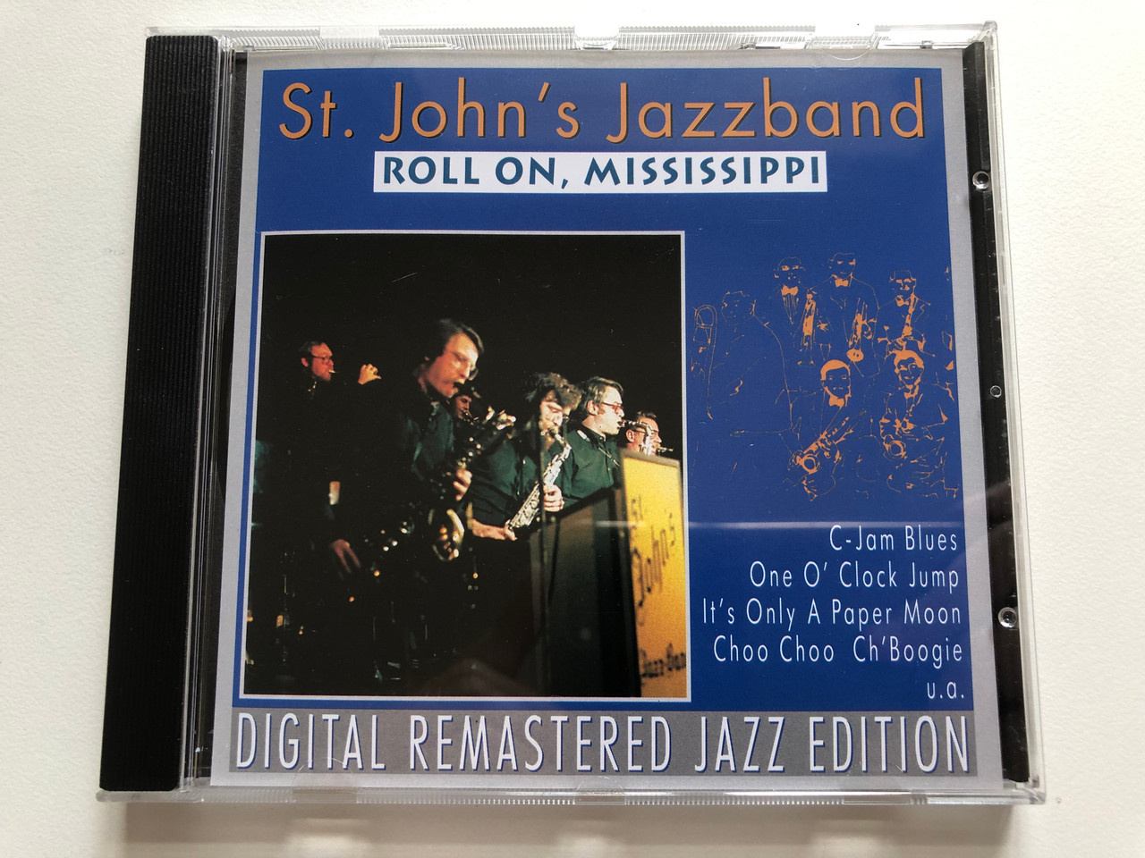 https://cdn10.bigcommerce.com/s-62bdpkt7pb/products/0/images/211732/St._Johns_Jazzband_-_Roll_On_Mississippi_C-Jam_Blues_One_O_Clock_Jump_Its_Only_A_Paper_Moon_Choo_Choo_ChBoogie_u.a._Digital_Remastered_Jazz_Edition_Pastels_Audio_CD_1995_CD_20_1__38312.1643960780.1280.1280.JPG?c=2&_gl=1*yai16r*_ga*MjA2NTIxMjE2MC4xNTkwNTEyNTMy*_ga_WS2VZYPC6G*MTY0Mzk1MjI3Ni4yODMuMS4xNjQzOTYwNzc2LjYw