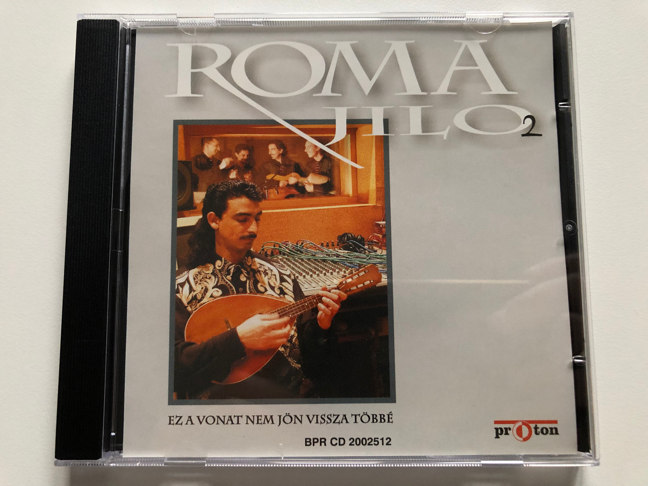 https://cdn10.bigcommerce.com/s-62bdpkt7pb/products/0/images/213149/Roma_Jilo_2_-_Ez_A_Vonat_Nem_Jon_Vissza_Tobbe_proton_Audio_CD_BPR_CD_2002512_1__90562.1644904136.1280.1280.JPG?c=2&_gl=1*lp4end*_ga*MjA2NTIxMjE2MC4xNTkwNTEyNTMy*_ga_WS2VZYPC6G*MTY0NDkwMTUzNS4yODYuMS4xNjQ0OTAzNzk2LjU3