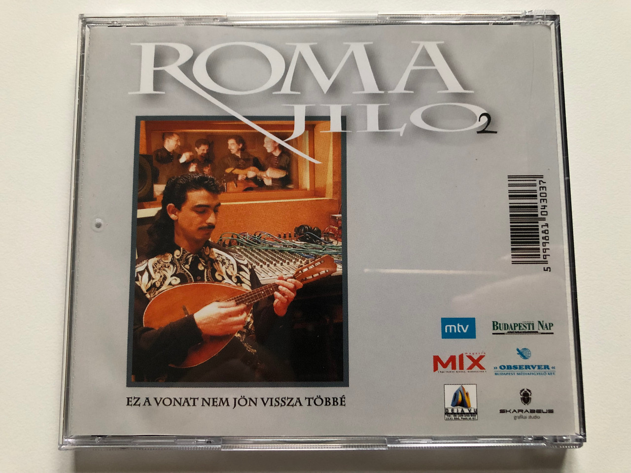 https://cdn10.bigcommerce.com/s-62bdpkt7pb/products/0/images/213150/Roma_Jilo_2_-_Ez_A_Vonat_Nem_Jon_Vissza_Tobbe_proton_Audio_CD_BPR_CD_2002512_4__66970.1644904136.1280.1280.JPG?c=2&_gl=1*lp4end*_ga*MjA2NTIxMjE2MC4xNTkwNTEyNTMy*_ga_WS2VZYPC6G*MTY0NDkwMTUzNS4yODYuMS4xNjQ0OTAzNzk2LjU3