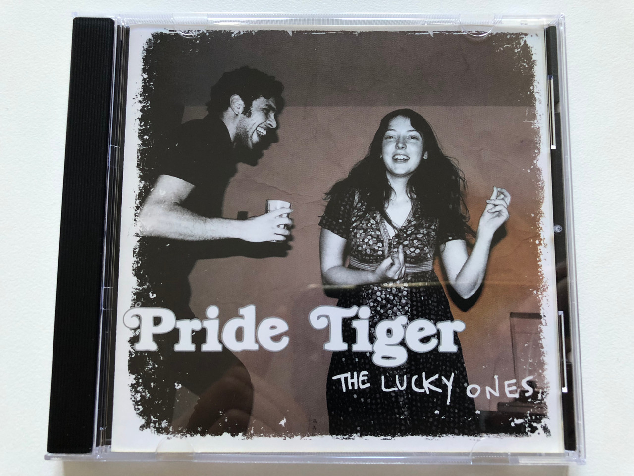 https://cdn10.bigcommerce.com/s-62bdpkt7pb/products/0/images/213230/Pride_Tiger_The_Lucky_Ones_EMI_Music_Canada_Audio_CD_2008_50999-506027-2-8_1__01390.1644955788.1280.1280.JPG?c=2&_gl=1*jtg2vu*_ga*MjA2NTIxMjE2MC4xNTkwNTEyNTMy*_ga_WS2VZYPC6G*MTY0NDk1MTQzNi4yODkuMS4xNjQ0OTU1NjY3LjU4