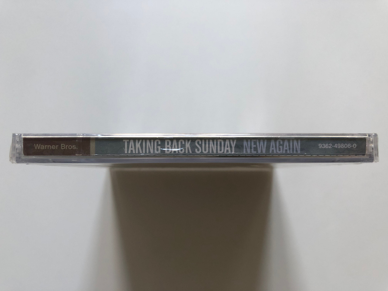 https://cdn10.bigcommerce.com/s-62bdpkt7pb/products/0/images/213310/Taking_Back_Sunday_New_Again_Featuring_Sink_Into_Me_Warner_Bros._Records_Audio_CD_2009_9362-49806-0_3__64711.1645003694.1280.1280.JPG?c=2&_gl=1*fh39k*_ga*MjA2NTIxMjE2MC4xNTkwNTEyNTMy*_ga_WS2VZYPC6G*MTY0NDk5NTYyMy4yOTAuMS4xNjQ1MDAzMjgyLjQ0