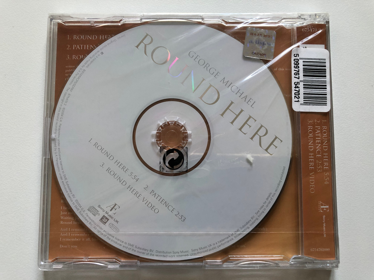 https://cdn10.bigcommerce.com/s-62bdpkt7pb/products/0/images/213329/George_Michael_Round_Here_Sony_Music_UK_Audio_CD_2004_675470_2_2__81860.1645006807.1280.1280.JPG?c=2&_gl=1*l0089s*_ga*MjA2NTIxMjE2MC4xNTkwNTEyNTMy*_ga_WS2VZYPC6G*MTY0NDk5NTYyMy4yOTAuMS4xNjQ1MDA2Njk4LjQy