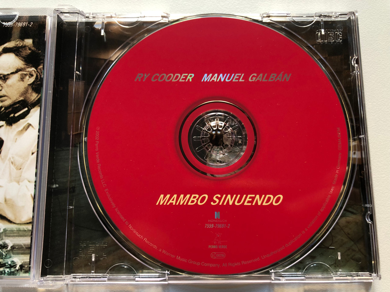 https://cdn10.bigcommerce.com/s-62bdpkt7pb/products/0/images/213829/Ry_Cooder_Manuel_Galbn_Mambo_Sinuendo_Nonesuch_Audio_CD_2003_7559-79691-2_3__18812.1645463722.1280.1280.JPG?c=2&_gl=1*1sqe2cj*_ga*MjA2NTIxMjE2MC4xNTkwNTEyNTMy*_ga_WS2VZYPC6G*MTY0NTQ1ODQ2NC4yOTYuMS4xNjQ1NDYzNzEyLjYw