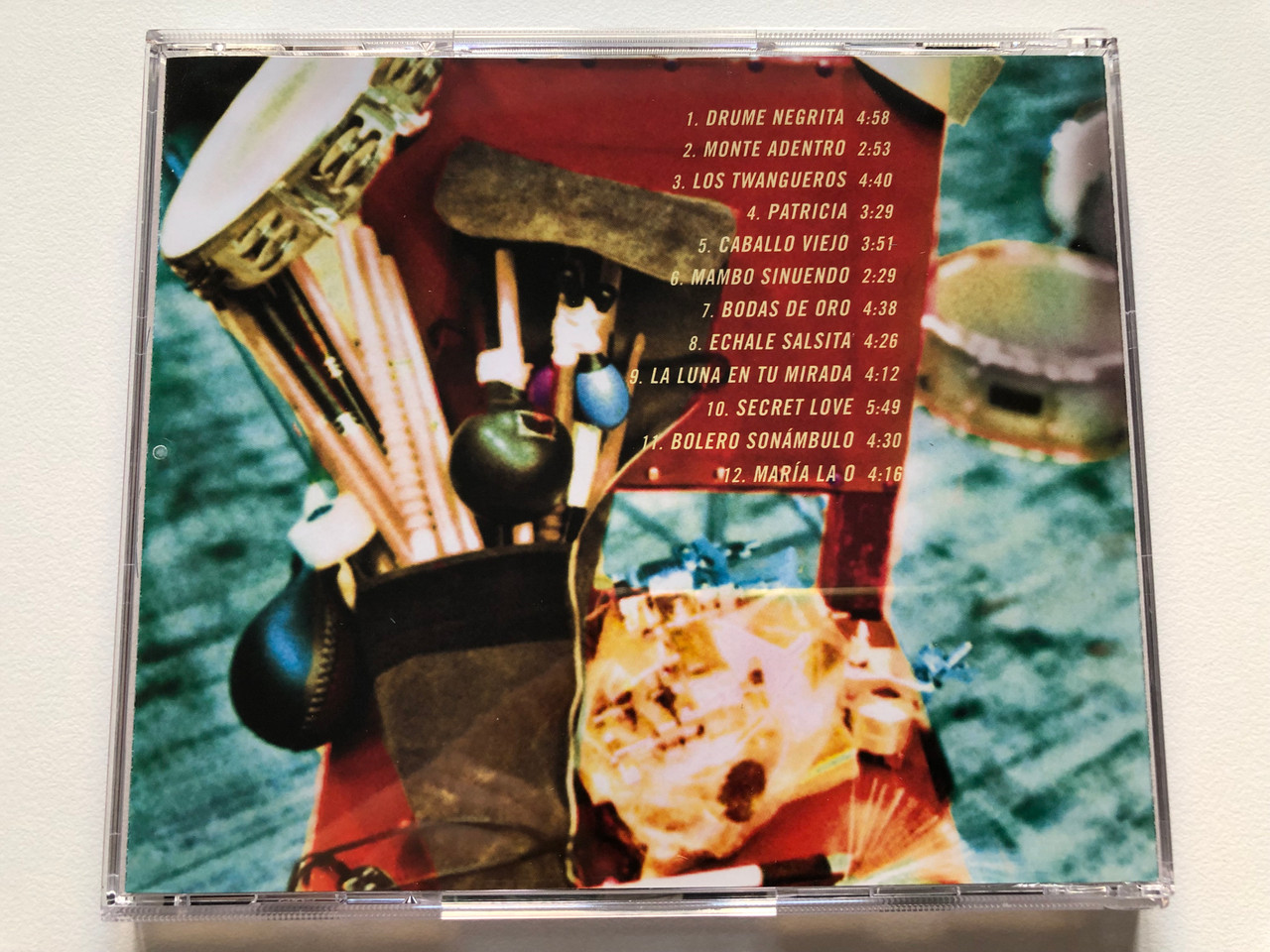 https://cdn10.bigcommerce.com/s-62bdpkt7pb/products/0/images/213832/Ry_Cooder_Manuel_Galbn_Mambo_Sinuendo_Nonesuch_Audio_CD_2003_7559-79691-2_8__27950.1645463726.1280.1280.JPG?c=2&_gl=1*1sqe2cj*_ga*MjA2NTIxMjE2MC4xNTkwNTEyNTMy*_ga_WS2VZYPC6G*MTY0NTQ1ODQ2NC4yOTYuMS4xNjQ1NDYzNzEyLjYw