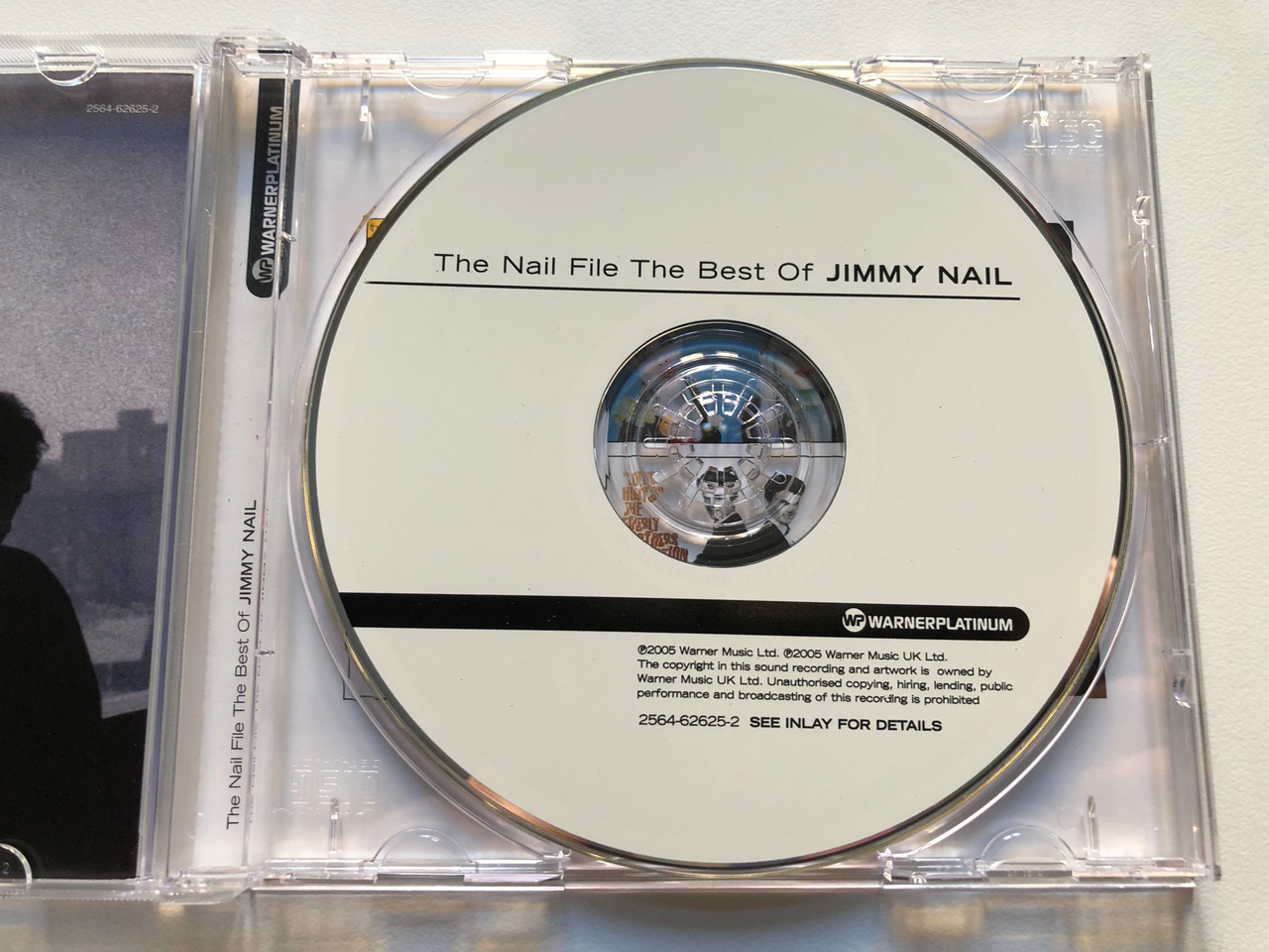 https://cdn10.bigcommerce.com/s-62bdpkt7pb/products/0/images/213837/The_Nail_File_The_Best_Of_Jimmy_Nail_Warner_Platinum_Warner_Strategic_Marketing_United_Kingdom_Audio_CD_2005_2564-62625-2_3__38810.1645464764.1280.1280.JPG?c=2&_gl=1*4c6mqv*_ga*MjA2NTIxMjE2MC4xNTkwNTEyNTMy*_ga_WS2VZYPC6G*MTY0NTQ1ODQ2NC4yOTYuMS4xNjQ1NDY0NzYyLjYw