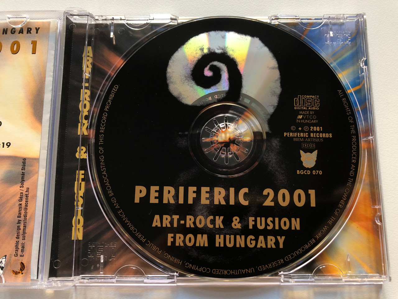 https://cdn10.bigcommerce.com/s-62bdpkt7pb/products/0/images/213844/Periferic_2001_Art-Rock_Fusion_From_Hungary_Periferic_Records_Audio_CD_2001_BGCD_070_3__53151.1645465094.1280.1280.JPG?c=2&_gl=1*1ee7keg*_ga*MjA2NTIxMjE2MC4xNTkwNTEyNTMy*_ga_WS2VZYPC6G*MTY0NTQ1ODQ2NC4yOTYuMS4xNjQ1NDY0OTU1LjQ3