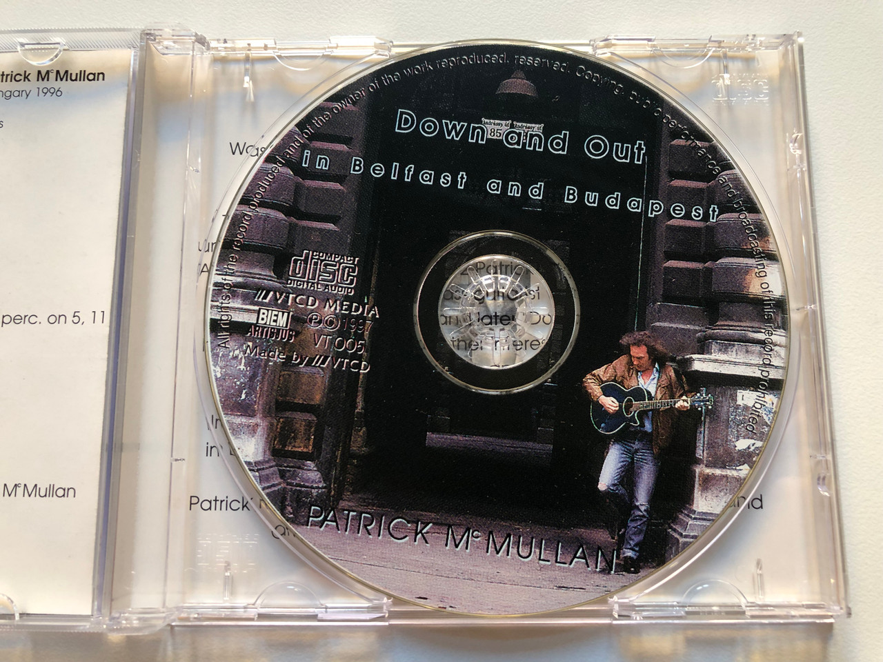 https://cdn10.bigcommerce.com/s-62bdpkt7pb/products/0/images/213854/Down_And_Out_In_Belfast_And_Budapest_-_Patrick_McMullan_VTCD_Media_Audio_CD_1997_VT_005_3__40769.1645465400.1280.1280.JPG?c=2&_gl=1*pz795i*_ga*MjA2NTIxMjE2MC4xNTkwNTEyNTMy*_ga_WS2VZYPC6G*MTY0NTQ1ODQ2NC4yOTYuMS4xNjQ1NDY1MjkxLjU4