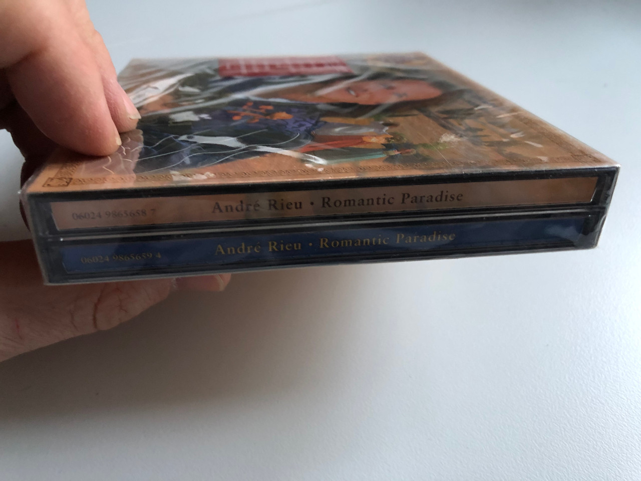 https://cdn10.bigcommerce.com/s-62bdpkt7pb/products/0/images/213876/Andr_Rieu_Romantic_Paradise_Limited_Edition_2_CD_Set._Containing_A_Personal_Thank_You_Gift_CD_From_Andre_Rieu_Which_Includes_16_Brand_New_Titles_Polydor_2x_Audio_CD_2003_9865660_4__76356.1645468064.1280.1280.JPG?c=2&_gl=1*1gr4d9l*_ga*MjA2NTIxMjE2MC4xNTkwNTEyNTMy*_ga_WS2VZYPC6G*MTY0NTQ1ODQ2NC4yOTYuMS4xNjQ1NDY3ODMzLjYw