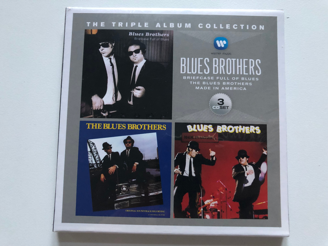 https://cdn10.bigcommerce.com/s-62bdpkt7pb/products/0/images/213883/Blues_Brothers_The_Triple_Album_Collection_Briefcase_Full_Of_Blues_The_Blues_Brothers_Made_In_America_Warner_Music_3x_Audio_CD_2013_Box_Set_8122796674_1__38398.1645468929.1280.1280.JPG?c=2&_gl=1*13jyg1v*_ga*MjA2NTIxMjE2MC4xNTkwNTEyNTMy*_ga_WS2VZYPC6G*MTY0NTQ1ODQ2NC4yOTYuMS4xNjQ1NDY4NjI4LjUy