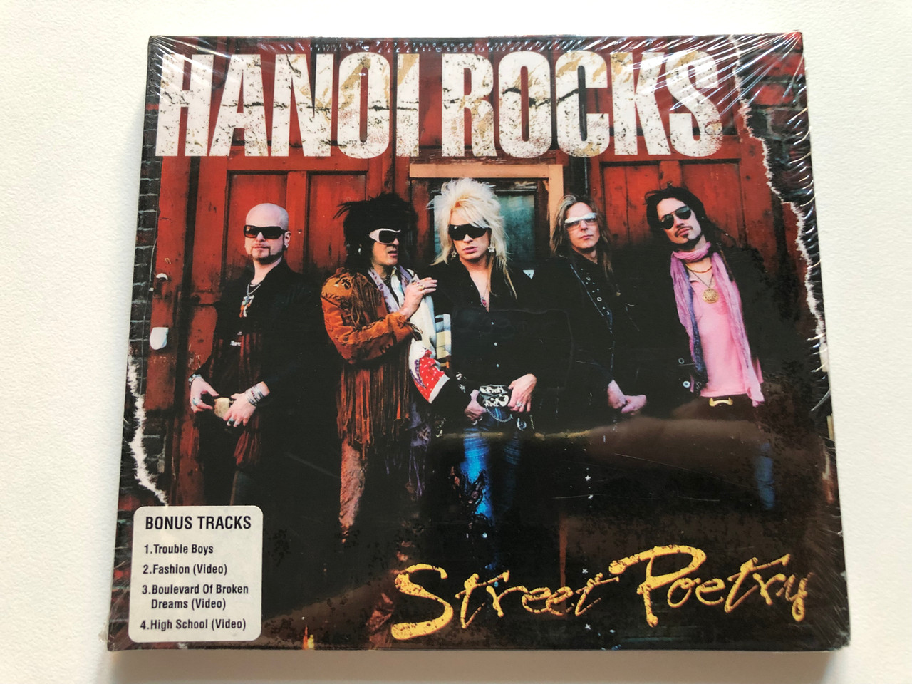 https://cdn10.bigcommerce.com/s-62bdpkt7pb/products/0/images/213906/Hanoi_Rocks_Street_Poetry_Bonus_Tracks_1._Trouble_Boys_2._Fashion_Video_3._Boulevard_Of_Broken_Dreams_Video_4._High_School_Video_Demolition_Records_Audio_CD_DEMCDD161_1__79520.1645473063.1280.1280.JPG?c=2&_gl=1*8kq13r*_ga*MjA2NTIxMjE2MC4xNTkwNTEyNTMy*_ga_WS2VZYPC6G*MTY0NTQ1ODQ2NC4yOTYuMS4xNjQ1NDcyOTA5LjU4