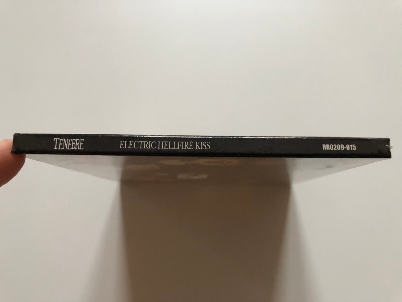 https://cdn10.bigcommerce.com/s-62bdpkt7pb/products/0/images/214102/International_Magik_Group_Tenebre_performs_Electric_Hellfire_Kiss_Regain_Records_Audio_CD_RR0209-015_3__40881.1645620417.1280.1280.JPG?c=2&_gl=1*xy7d0i*_ga*MjA2NTIxMjE2MC4xNTkwNTEyNTMy*_ga_WS2VZYPC6G*MTY0NTYxOTU2OS4yOTkuMS4xNjQ1NjIwMjUxLjM2