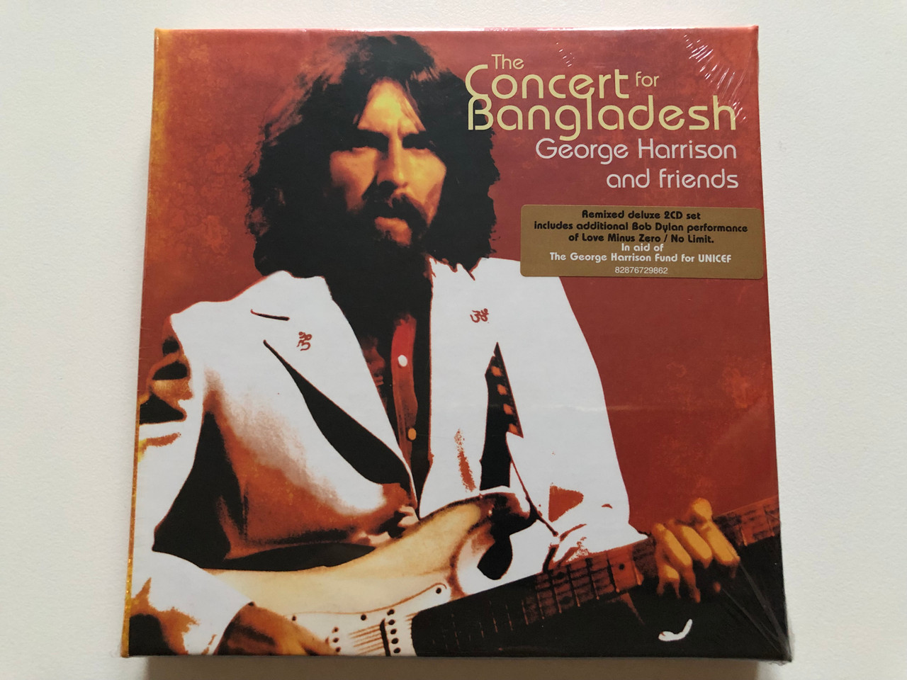 https://cdn10.bigcommerce.com/s-62bdpkt7pb/products/0/images/214109/The_Concert_For_Bangladesh_-_George_Harrison_And_Friends_Epic_2x_Audio_CD_2005_82876729862_1__11836.1645620943.1280.1280.JPG?c=2&_gl=1*wmw8sv*_ga*MjA2NTIxMjE2MC4xNTkwNTEyNTMy*_ga_WS2VZYPC6G*MTY0NTYxOTU2OS4yOTkuMS4xNjQ1NjIwODIwLjQy