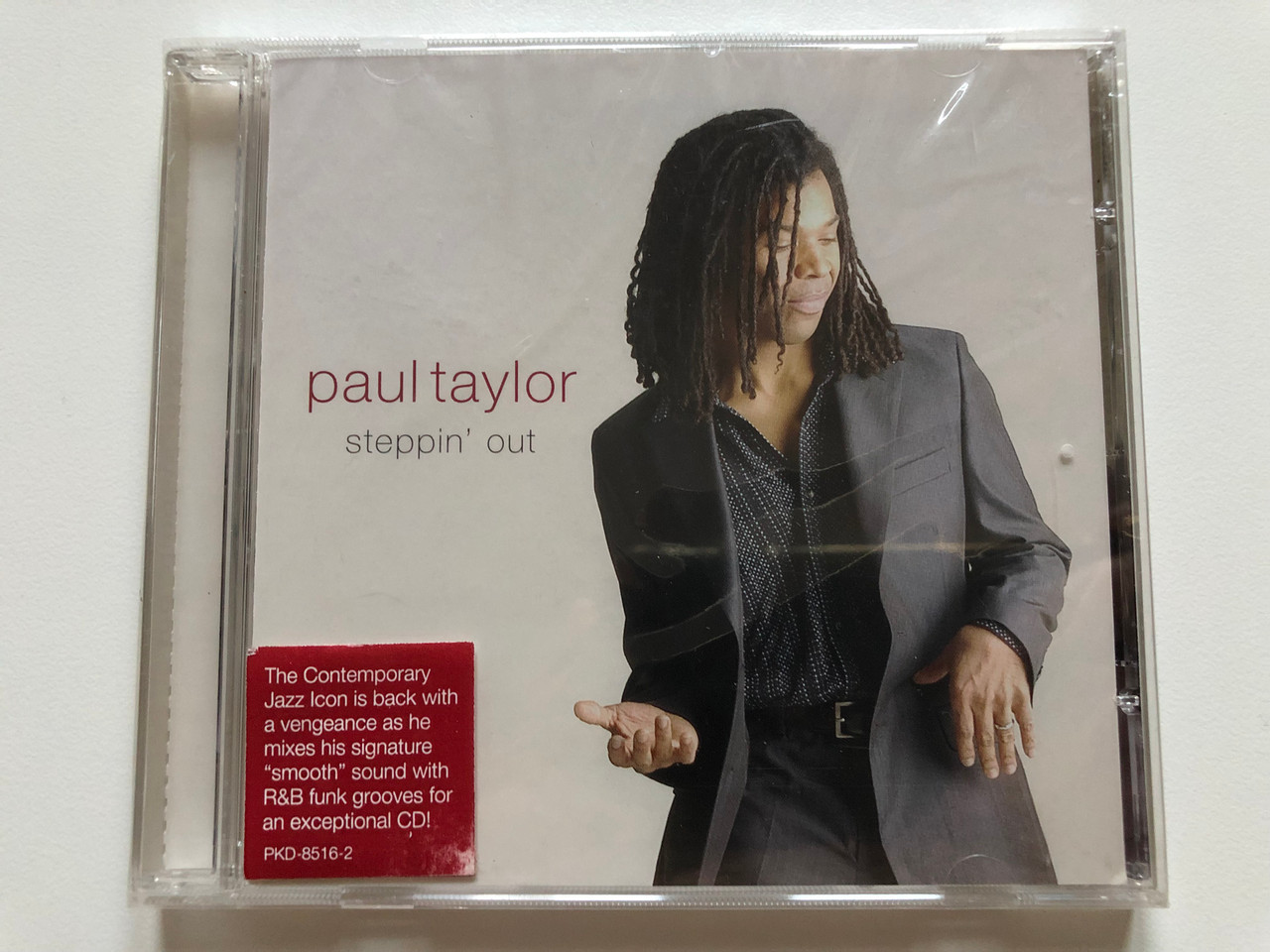 https://cdn10.bigcommerce.com/s-62bdpkt7pb/products/0/images/214181/Paul_Taylor_Steppin_Out_The_Contemporary_Jazz_Icon_is_back_with_a_vengeance_as_he_mixes_his_signature_smooth_sound_with_RB_funk_grooves_for_an_exceptional_CD_Peak_Records_Audio_CD_1__68531.1645708934.1280.1280.JPG?c=2&_gl=1*tas5o1*_ga*MjA2NTIxMjE2MC4xNTkwNTEyNTMy*_ga_WS2VZYPC6G*MTY0NTcwNzQzNS4zMDAuMS4xNjQ1NzA4NzIyLjM2