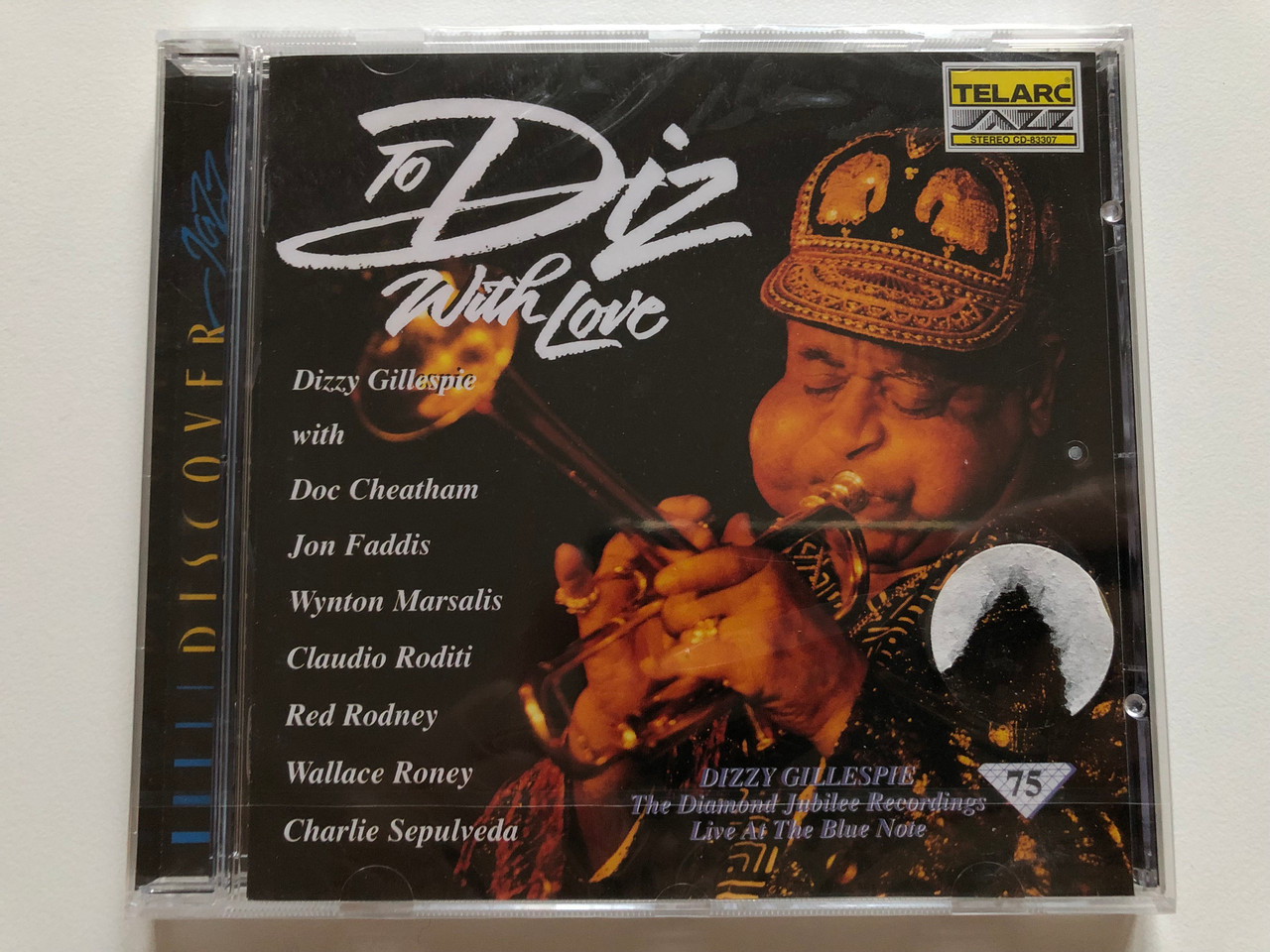 https://cdn10.bigcommerce.com/s-62bdpkt7pb/products/0/images/214197/To_Diz_With_Love_Live_At_The_Blue_Note_Dizzy_Gillespie_with_Doc_Cheatham_Jon_Faddis_Wynton_Marsalis_Claudio_Roditi_Red_Rodney_Wallace_Roney_Charlie_Sepulveda_Telarc_Jazz_Audio_CD_1_1__27458.1645710914.1280.1280.JPG?c=2&_gl=1*1v74u6z*_ga*MjA2NTIxMjE2MC4xNTkwNTEyNTMy*_ga_WS2VZYPC6G*MTY0NTcwNzQzNS4zMDAuMS4xNjQ1NzEwNjAxLjUy