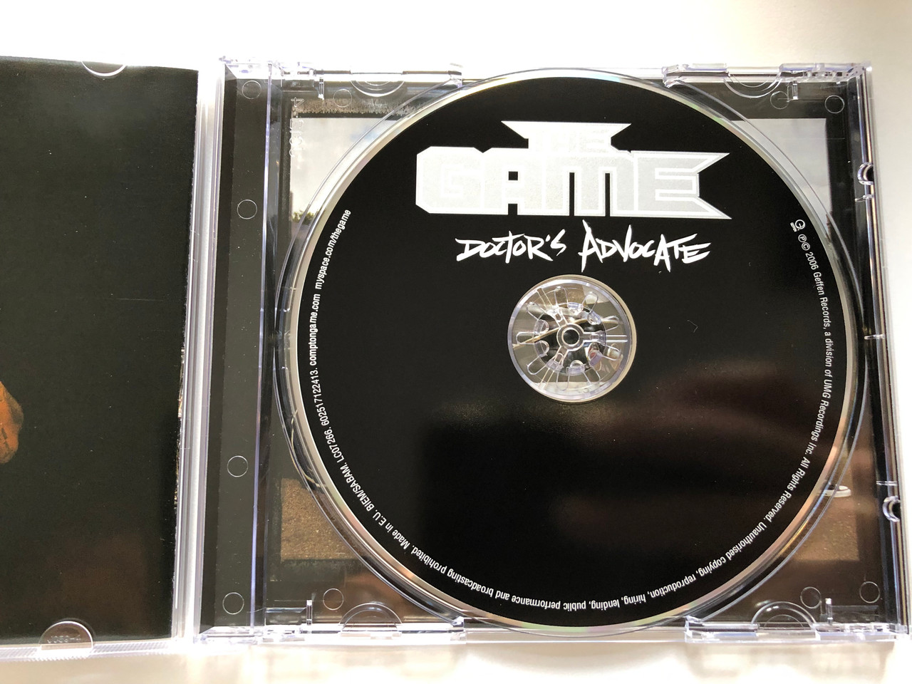https://cdn10.bigcommerce.com/s-62bdpkt7pb/products/0/images/214444/The_Game_Doctors_Advocate_Geffen_Records_Audio_CD_2006_0602517205017_3__23576.1646025012.1280.1280.JPG?c=2&_gl=1*1l6gsa2*_ga*MjA2NTIxMjE2MC4xNTkwNTEyNTMy*_ga_WS2VZYPC6G*MTY0NjAxOTM2NS4zMDQuMS4xNjQ2MDI0OTkzLjYw