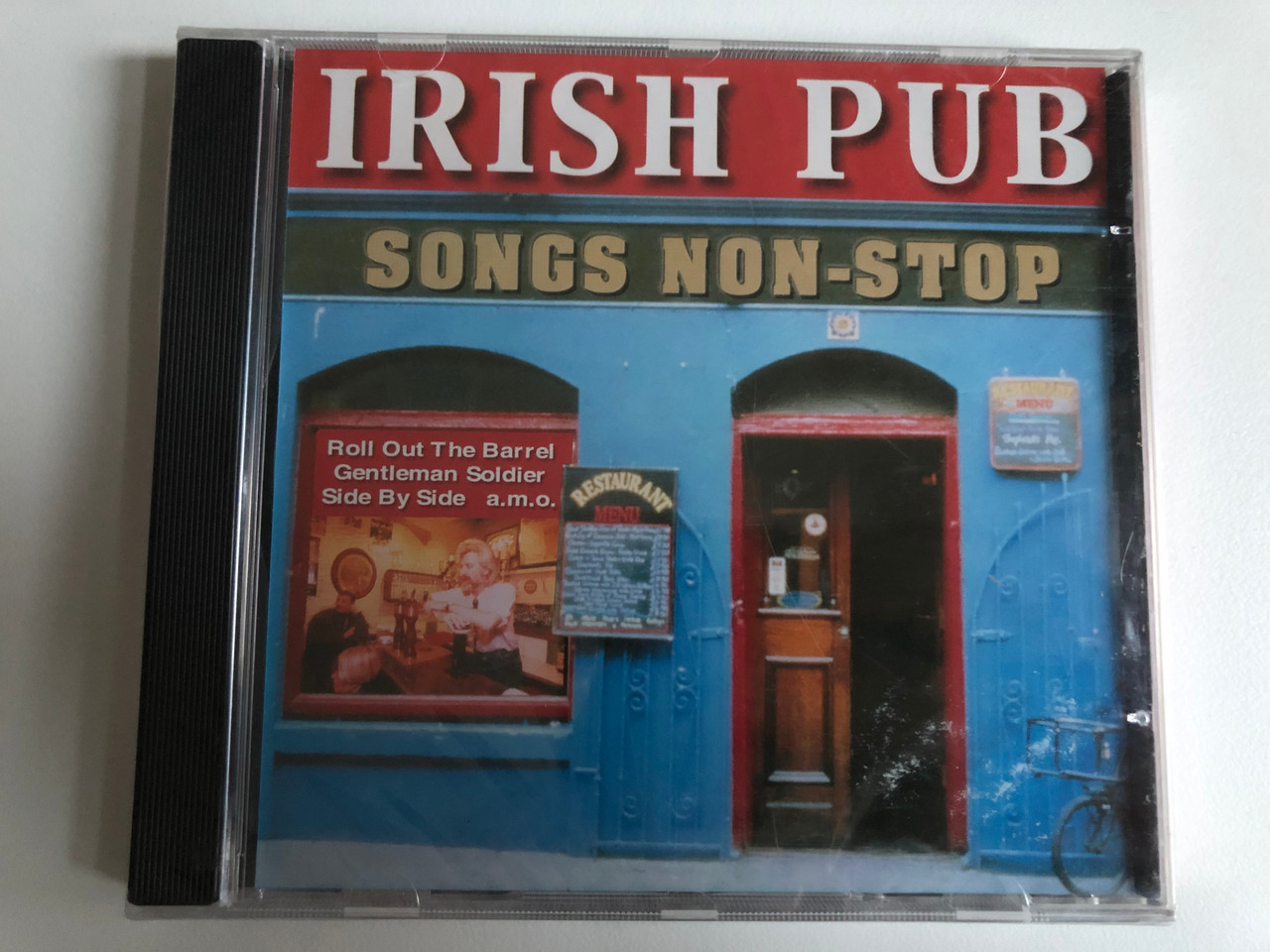 https://cdn10.bigcommerce.com/s-62bdpkt7pb/products/0/images/214724/Irish_Pub_-_Songs_Non-Stop_Eurotrend_Audio_CD_Stereo_CD_152_1__81309.1646196369.1280.1280.JPG?c=2&_gl=1*ertc9j*_ga*MjA2NTIxMjE2MC4xNTkwNTEyNTMy*_ga_WS2VZYPC6G*MTY0NjE5Mjg1NC4zMDcuMS4xNjQ2MTk1OTk5LjU2