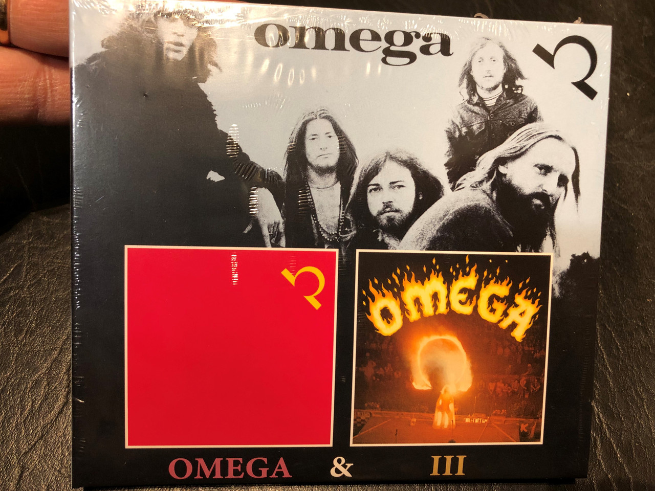https://cdn10.bigcommerce.com/s-62bdpkt7pb/products/0/images/214747/Omega_Omega_III_MIG_2x_Audio_CD_2022_MIG02582_1__54200.1646198955.1280.1280.JPG?c=2&_gl=1*tzrg0s*_ga*MjA2NTIxMjE2MC4xNTkwNTEyNTMy*_ga_WS2VZYPC6G*MTY0NjE5Mjg1NC4zMDcuMS4xNjQ2MTk4ODA5LjE5