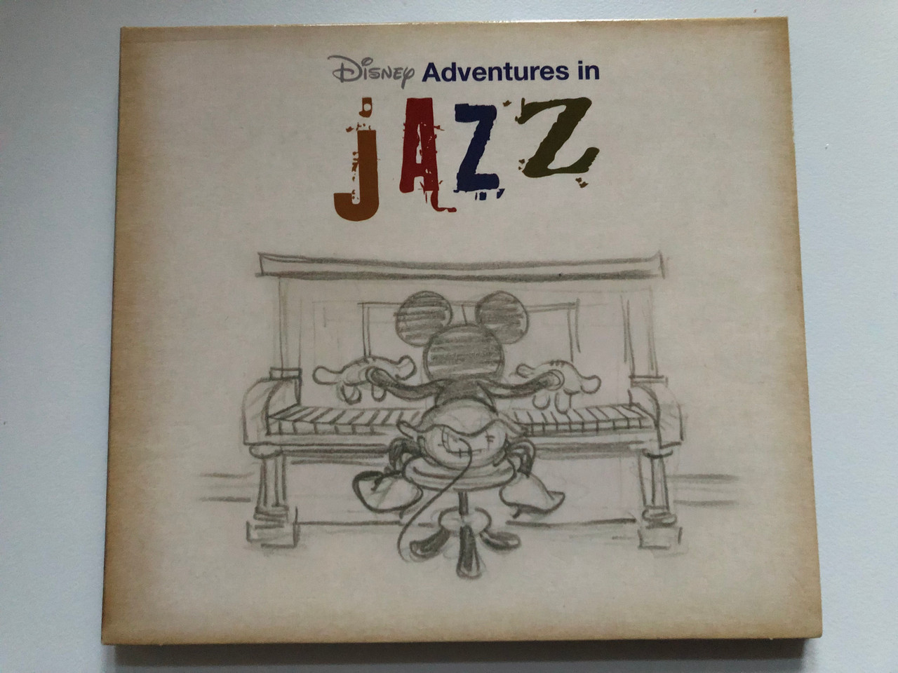 https://cdn10.bigcommerce.com/s-62bdpkt7pb/products/0/images/215437/Disney_Adventures_in_Jazz_Walt_Disney_Records_Audio_CD_2001_5099926410821_1__57625.1646713015.1280.1280.JPG?c=2&_gl=1*aa46sx*_ga*MjA2NTIxMjE2MC4xNTkwNTEyNTMy*_ga_WS2VZYPC6G*MTY0NjcxMjI0NS4zMTMuMS4xNjQ2NzEyNzUxLjQw