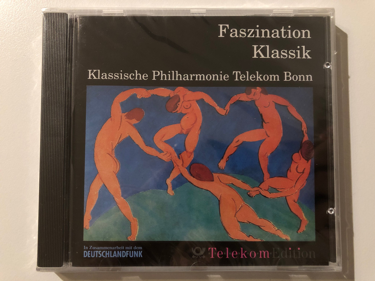 https://cdn10.bigcommerce.com/s-62bdpkt7pb/products/0/images/215544/Faszination_Klassik_Klassische_Philharmonie_Telekom_Bonn_Aurophon_Audio_CD_1992_AU_32086_1__24173.1646734879.1280.1280.JPG?c=2&_gl=1*ucdv3u*_ga*MjA2NTIxMjE2MC4xNTkwNTEyNTMy*_ga_WS2VZYPC6G*MTY0NjczMzU5NS4zMTQuMS4xNjQ2NzM0NzQ3LjEz