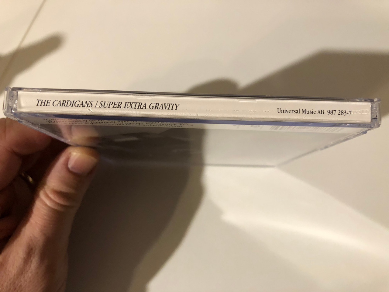https://cdn10.bigcommerce.com/s-62bdpkt7pb/products/0/images/216028/The_Cardigans_Super_Extra_Gravity_Universal_Music_AB._Audio_CD_2005_987_283-7_3__95226.1646907450.1280.1280.JPG?c=2&_gl=1*hpp760*_ga*MjA2NTIxMjE2MC4xNTkwNTEyNTMy*_ga_WS2VZYPC6G*MTY0NjkwMTAxNS4zMTcuMS4xNjQ2OTA3MzA0LjMz