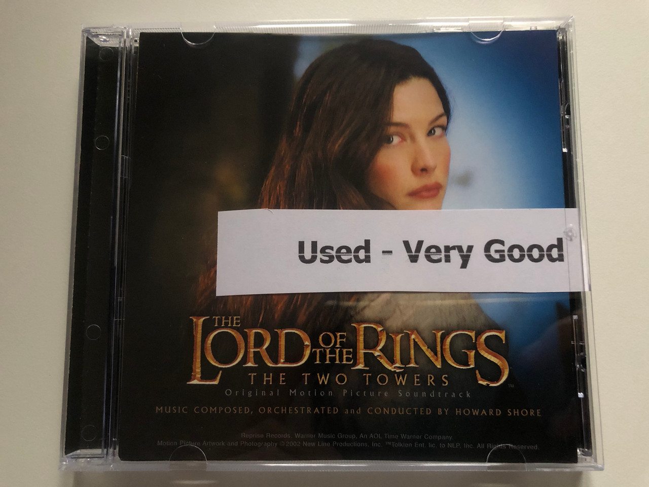 https://cdn10.bigcommerce.com/s-62bdpkt7pb/products/0/images/216378/The_Lord_Of_The_Rings_The_Two_Towers_Original_Motion_Picture_Soundtrack_Music_Composed_Orchestrated_and_Conducted_By_Howard_Shore_Reprise_Records_Audio_CD_2002_9362-48379-2_1__76476.1647271831.1280.1280.JPG?c=2&_gl=1*lh045y*_ga*MjA2NTIxMjE2MC4xNTkwNTEyNTMy*_ga_WS2VZYPC6G*MTY0NzI3MDg0Ny4zMTkuMS4xNjQ3MjcxNzIyLjYw