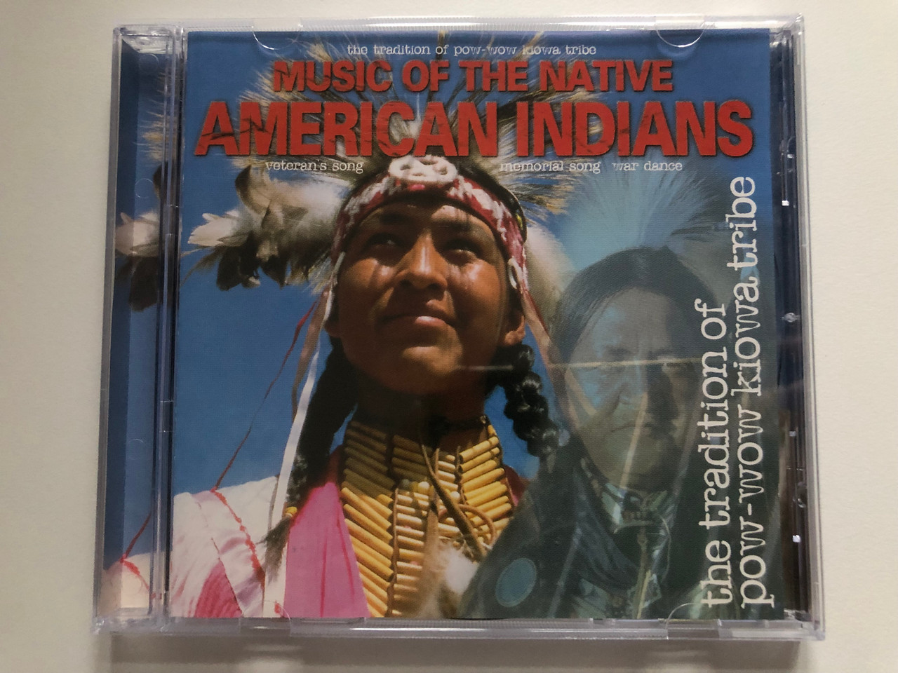 https://cdn10.bigcommerce.com/s-62bdpkt7pb/products/0/images/216421/Music_Of_The_Native_American_Indians_-_The_Tradition_Of_Pow_Pow_Kiowa_Tribe_Veterans_Song_Memorial_Song_War_Dance_Galaxy_Music_Ltd._Audio_CD_1999_3889032_1__87907.1647278471.1280.1280.JPG?c=2&_gl=1*cfng6h*_ga*MjA2NTIxMjE2MC4xNTkwNTEyNTMy*_ga_WS2VZYPC6G*MTY0NzI3NTgwOC4zMjAuMS4xNjQ3Mjc3OTc1LjY.