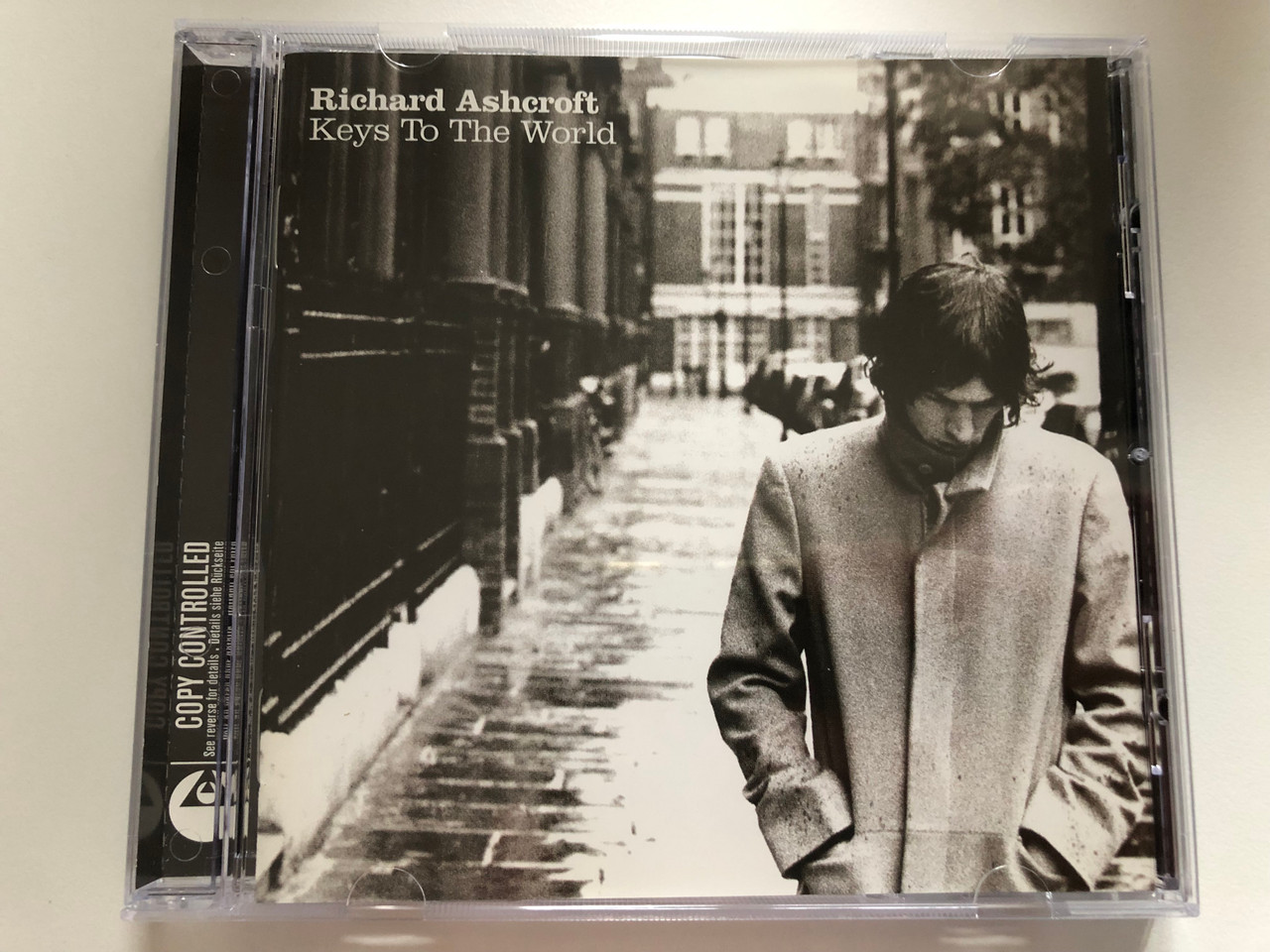 https://cdn10.bigcommerce.com/s-62bdpkt7pb/products/0/images/216585/Richard_Ashcroft_Keys_To_The_World_Parlophone_Audio_CD_2006_094634837323_1__35060.1647449759.1280.1280.JPG?c=2&_gl=1*3r9rul*_ga*MjA2NTIxMjE2MC4xNTkwNTEyNTMy*_ga_WS2VZYPC6G*MTY0NzQ0MjQ1MS4zMjIuMS4xNjQ3NDQ5NTQ1LjU5
