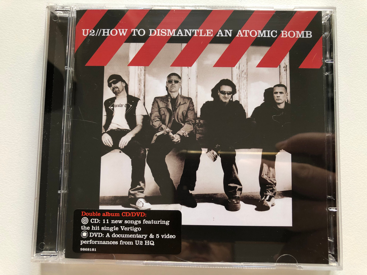https://cdn10.bigcommerce.com/s-62bdpkt7pb/products/0/images/216882/U2_How_To_Dismantle_An_Atomic_Bomb_Double_album_CDDVD_CD_11_new_songs_featuring_the_hit_single_Vertigo_DVD_A_documentary_5_video_performances_from_U5_HQ_Island_Records_Audio_CD_DVD_1__20939.1647532177.1280.1280.JPG?c=2&_gl=1*vl8xdw*_ga*MjA2NTIxMjE2MC4xNTkwNTEyNTMy*_ga_WS2VZYPC6G*MTY0NzUyNDk4OS4zMjMuMS4xNjQ3NTMxNzMxLjU0