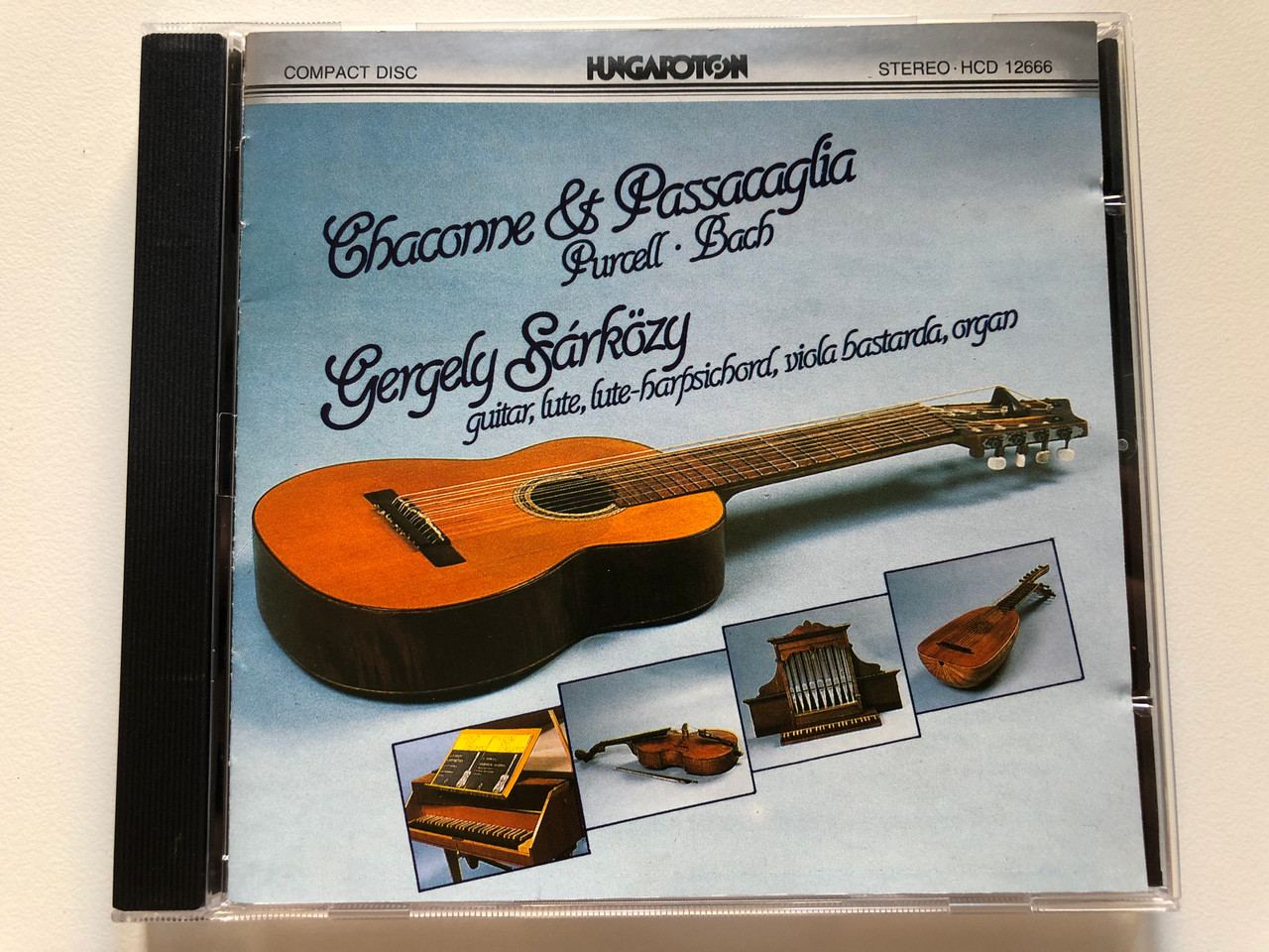 https://cdn10.bigcommerce.com/s-62bdpkt7pb/products/0/images/216937/Chaconne_Passacaglia_-_Purcell_Bach_Gergely_Srkzy_-_guitar_lute_lute-harpsichord_viola_bastarda_organ_Hungaroton_Audio_CD_1988_Stereo_HCD_12666_1__09521.1647536381.1280.1280.JPG?c=2&_gl=1*t6d113*_ga*MjA2NTIxMjE2MC4xNTkwNTEyNTMy*_ga_WS2VZYPC6G*MTY0NzUyNDk4OS4zMjMuMS4xNjQ3NTM2MzM2LjYw