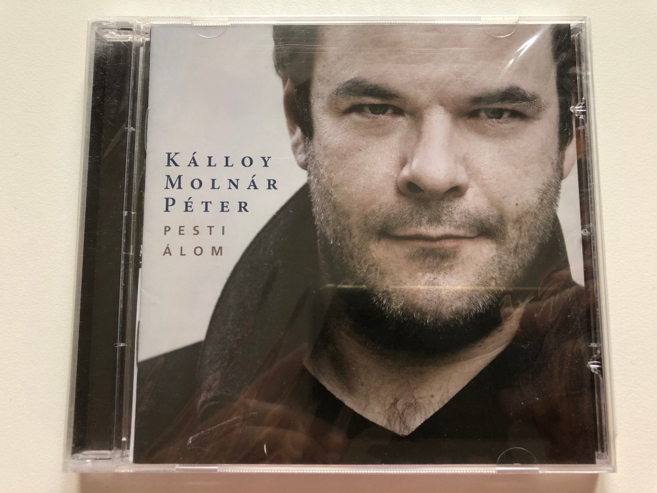 https://cdn10.bigcommerce.com/s-62bdpkt7pb/products/0/images/217979/Klloy_Molnr_Pter_Pesti_lom_EMI_Audio_CD_2009_4587252_1__12348.1647953778.1280.1280.JPG?c=2&_gl=1*vakbee*_ga*MjA2NTIxMjE2MC4xNTkwNTEyNTMy*_ga_WS2VZYPC6G*MTY0Nzk0Nzc1Ni4zMjcuMS4xNjQ3OTUzNzg1LjYw