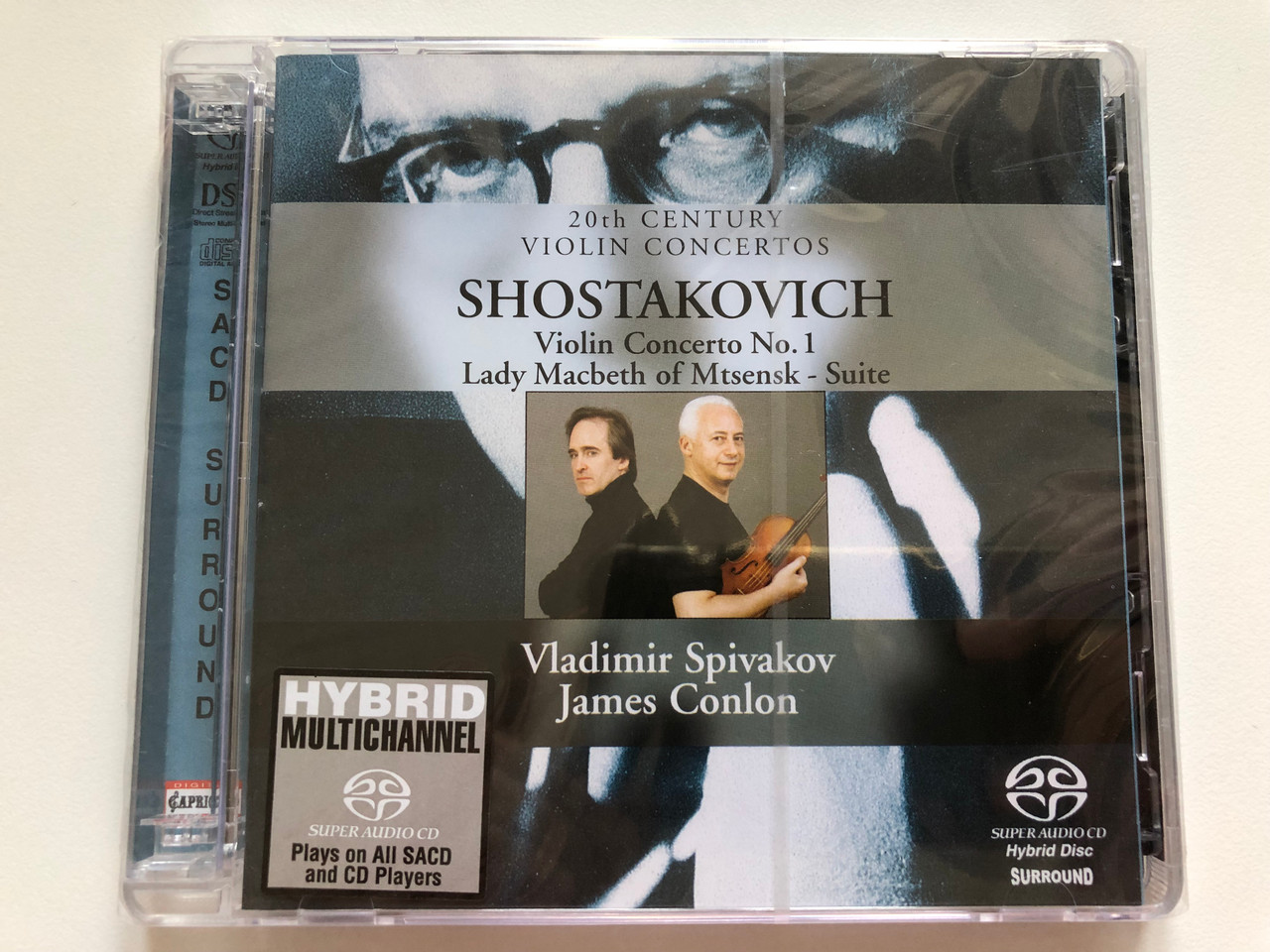 https://cdn10.bigcommerce.com/s-62bdpkt7pb/products/0/images/218053/20th_Century_Violin_Concertos_-_Shostakovich_-_Violin_Concerto_No.1_Lady_Macbeth_Of_Mtsensk_-_Suite_Vladimir_Spivakov_James_Conlon_Capriccio_2x_SACD_2003_71_004_1__15184.1647974269.1280.1280.JPG?c=2&_gl=1*1jmev5k*_ga*MjA2NTIxMjE2MC4xNTkwNTEyNTMy*_ga_WS2VZYPC6G*MTY0Nzk3NDA1My4zMjguMC4xNjQ3OTc0MDUzLjYw