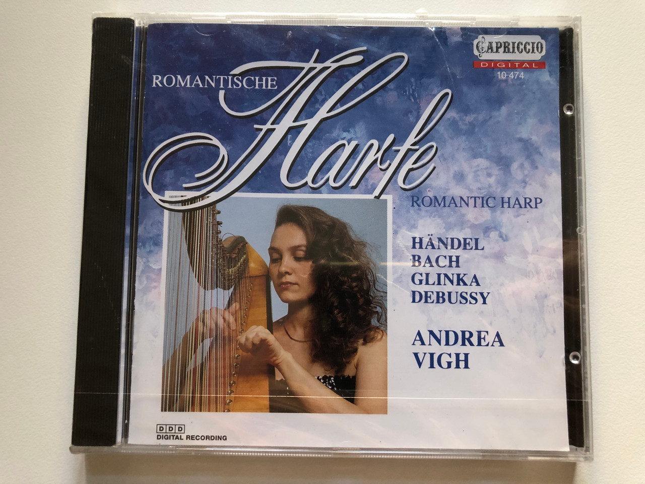 https://cdn10.bigcommerce.com/s-62bdpkt7pb/products/0/images/218426/Andrea_Vigh_-_Romantische_Harfe_Romantic_Harp_-_Handel_Bach_Glinka_Debussy_Capriccio_Audio_CD_1993_Stereo_10_474_1__25095.1648218436.1280.1280.JPG?c=2&_gl=1*1l3y4sm*_ga*MjA2NTIxMjE2MC4xNTkwNTEyNTMy*_ga_WS2VZYPC6G*MTY0ODIxMDI4Ny4zMzMuMS4xNjQ4MjE4MTk0LjM5