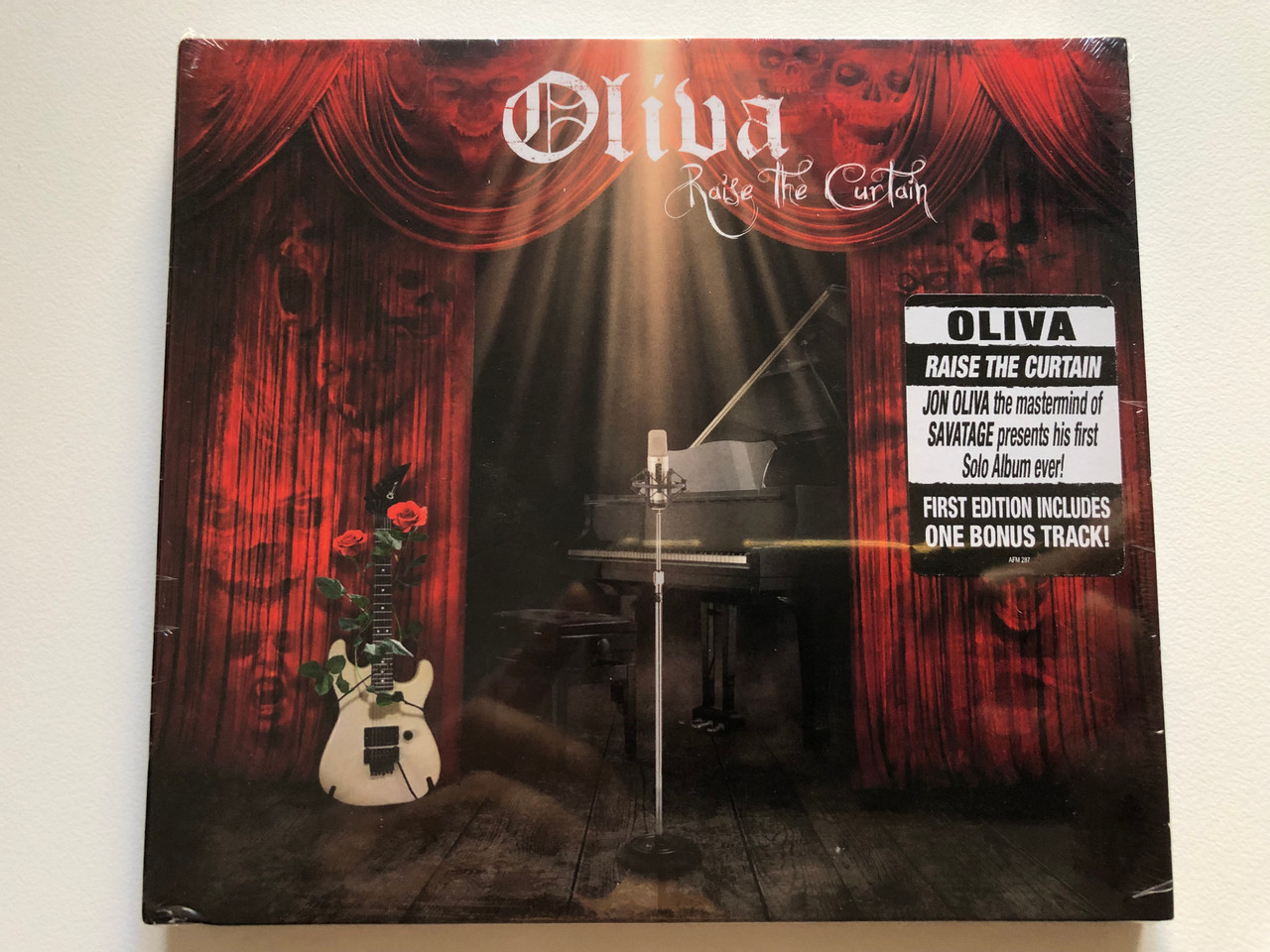 https://cdn10.bigcommerce.com/s-62bdpkt7pb/products/0/images/218444/Oliva_Raise_The_Curtain_Jon_Oliva_the_mastermind_of_Savatage_presents_his_first_Solo_Album_ever_First_Edition_Includes_One_Bonus_Track_AFM_Records_Audio_CD_2013_AFM_287-9_1__52053.1648222304.1280.1280.JPG?c=2&_gl=1*bu7ayv*_ga*MjA2NTIxMjE2MC4xNTkwNTEyNTMy*_ga_WS2VZYPC6G*MTY0ODIxMDI4Ny4zMzMuMS4xNjQ4MjIyNDA1LjYw