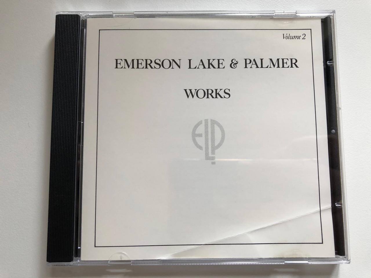 https://cdn10.bigcommerce.com/s-62bdpkt7pb/products/0/images/220082/Emerson_Lake_Palmer_-_Works_-_Volume_2_Atlantic_Audio_CD_7567-81538-2_1__02358.1648787682.1280.1280.JPG?c=2&_gl=1*i0gv5h*_ga*MjA2NTIxMjE2MC4xNTkwNTEyNTMy*_ga_WS2VZYPC6G*MTY0ODc4MDMyNC4zMzkuMS4xNjQ4Nzg3NDcxLjQw