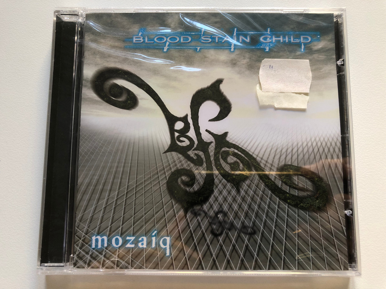 https://cdn10.bigcommerce.com/s-62bdpkt7pb/products/0/images/220690/Blood_Stain_Child_Mozaiq_Dockyard_1_Audio_CD_2007_DY100522_1__96934.1649175293.1280.1280.JPG?c=2&_gl=1*6hqd0t*_ga*MjA2NTIxMjE2MC4xNTkwNTEyNTMy*_ga_WS2VZYPC6G*MTY0OTE2ODI5OS4zNDMuMS4xNjQ5MTc1MTMxLjI5