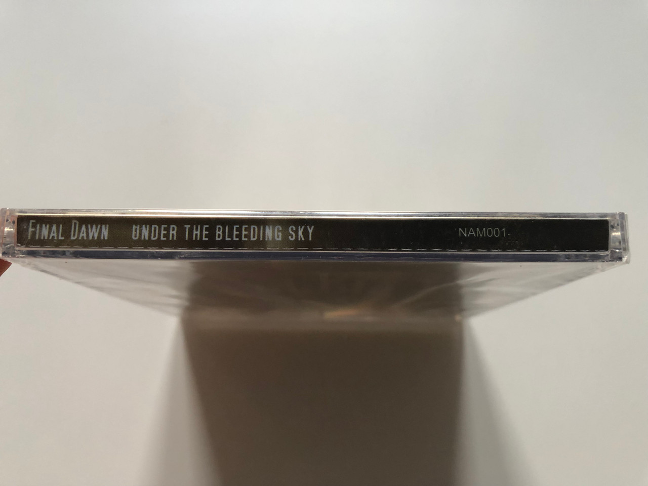https://cdn10.bigcommerce.com/s-62bdpkt7pb/products/0/images/220730/Final_Dawn_Under_The_Bleeding_Sky_New_Aeon_Media_Audio_CD_NAM001_3__48584.1649179950.1280.1280.JPG?c=2&_gl=1*1q4bvtp*_ga*MjA2NTIxMjE2MC4xNTkwNTEyNTMy*_ga_WS2VZYPC6G*MTY0OTE2ODI5OS4zNDMuMS4xNjQ5MTc5OTU4LjYw