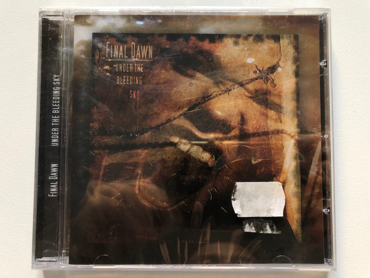 https://cdn10.bigcommerce.com/s-62bdpkt7pb/products/0/images/220732/Final_Dawn_Under_The_Bleeding_Sky_New_Aeon_Media_Audio_CD_NAM001_1__74381.1649179963.1280.1280.JPG?c=2&_gl=1*1q4bvtp*_ga*MjA2NTIxMjE2MC4xNTkwNTEyNTMy*_ga_WS2VZYPC6G*MTY0OTE2ODI5OS4zNDMuMS4xNjQ5MTc5OTU4LjYw