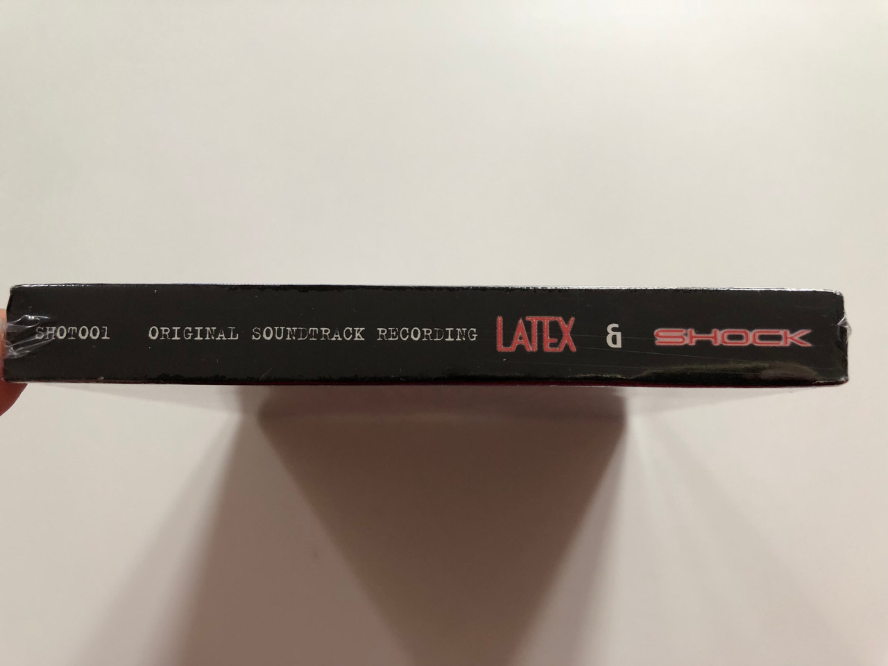 https://cdn10.bigcommerce.com/s-62bdpkt7pb/products/0/images/221088/Shock_Latex_Original_Soundtracks_Recordings_From_The_Michael_Ninn_Films_Popshot_2x_Audio_CD_SHOT001_3__15546.1649349939.1280.1280.JPG?c=2&_gl=1*1thk9iu*_ga*MjA2NTIxMjE2MC4xNTkwNTEyNTMy*_ga_WS2VZYPC6G*MTY0OTM0OTYyMy4zNDguMC4xNjQ5MzQ5NjIzLjYw
