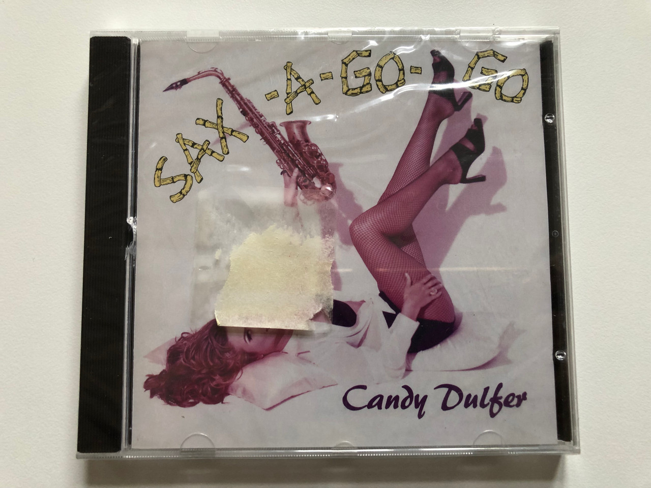 https://cdn10.bigcommerce.com/s-62bdpkt7pb/products/0/images/221219/Candy_Dulfer_Sax-A-Go-Go_BMG_Audio_CD_1993_74321_111812_1__43936.1649432059.1280.1280.JPG?c=2&_gl=1*u5rl7v*_ga*MjA2NTIxMjE2MC4xNTkwNTEyNTMy*_ga_WS2VZYPC6G*MTY0OTQyNjk4Mi4zNTEuMS4xNjQ5NDMxODQyLjU1