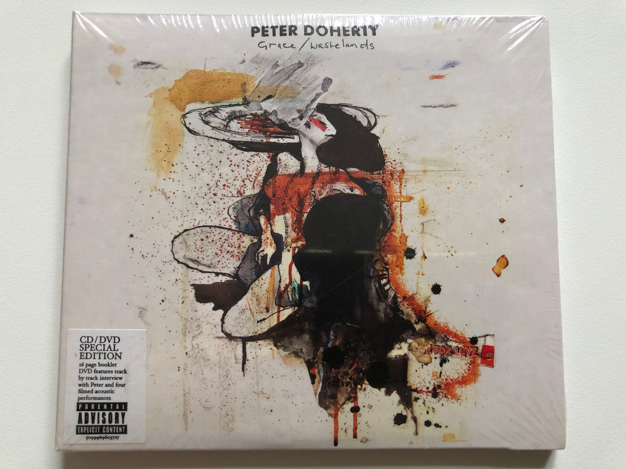 https://cdn10.bigcommerce.com/s-62bdpkt7pb/products/0/images/221279/Peter_Doherty_GraceWastelands_CDDVD_Special_Edition_-_16_page_booklet_DVD_features_track_by_track_interview_with_Peter_and_four_filmed_acoustic_performances_Parlophone_CD_DVD_Video_2009_1__15635.1649658614.1280.1280.JPG?c=2&_gl=1*2j6rpj*_ga*MjA2NTIxMjE2MC4xNTkwNTEyNTMy*_ga_WS2VZYPC6G*MTY0OTY1NzEzNy4zNTMuMS4xNjQ5NjU4MTExLjQ0
