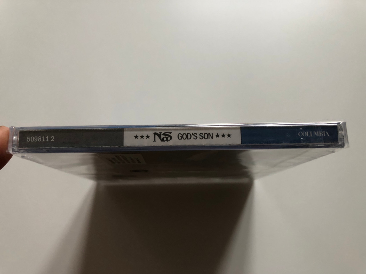https://cdn10.bigcommerce.com/s-62bdpkt7pb/products/0/images/221295/Nasir_Jones_Gods_Son_Columbia_Audio_CD_2002_509811_2_3__17513.1649661015.1280.1280.JPG?c=2&_gl=1*r5ggtd*_ga*MjA2NTIxMjE2MC4xNTkwNTEyNTMy*_ga_WS2VZYPC6G*MTY0OTY1NzEzNy4zNTMuMS4xNjQ5NjYwOTIyLjE.