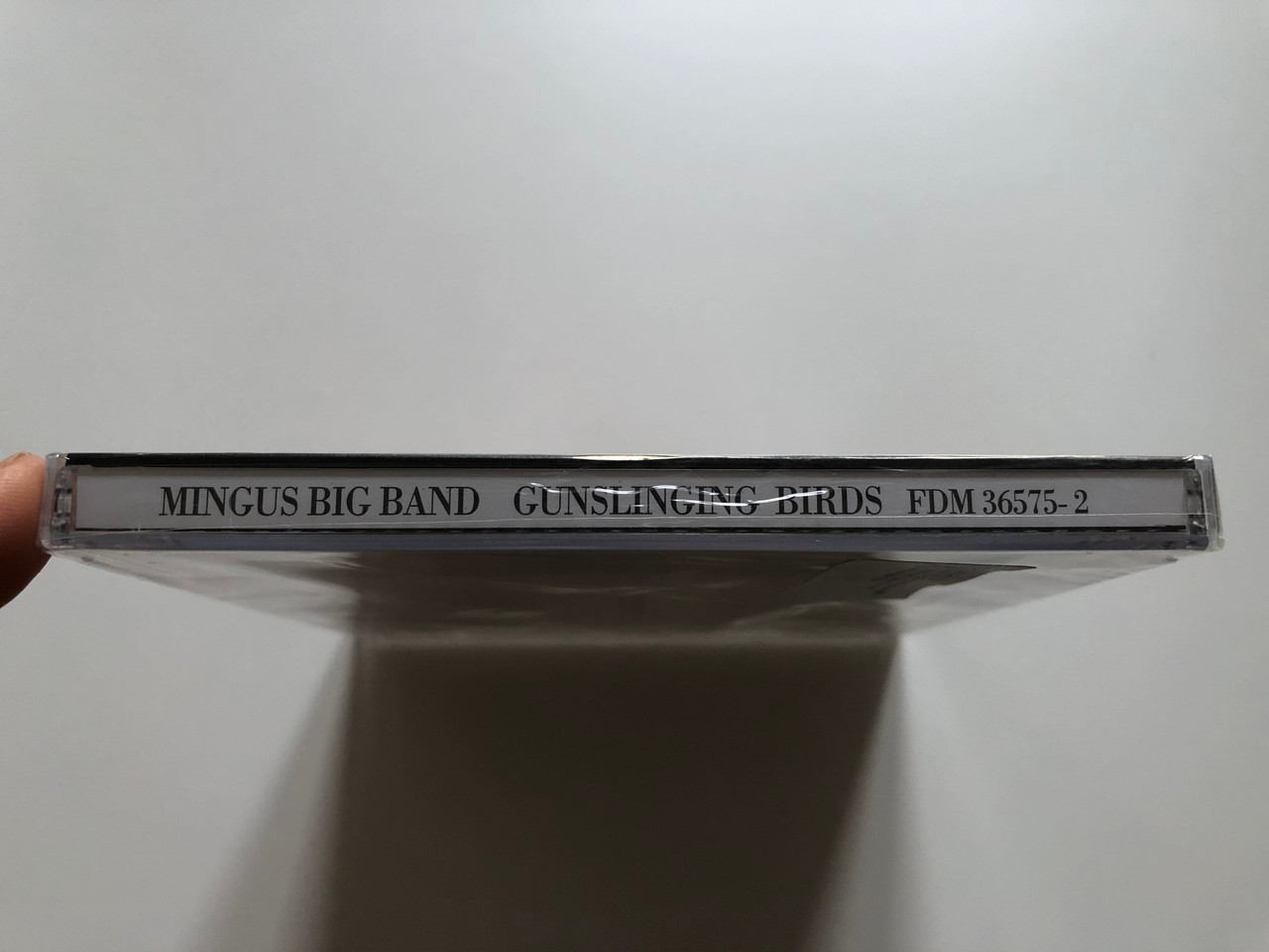 https://cdn10.bigcommerce.com/s-62bdpkt7pb/products/0/images/221307/Mingus_Big_Band_Gunslinging_Birds_Dreyfus_Jazz_Audio_CD_1995_FDM_36575-2_3__42870.1649662160.1280.1280.JPG?c=2&_gl=1*tu4od0*_ga*MjA2NTIxMjE2MC4xNTkwNTEyNTMy*_ga_WS2VZYPC6G*MTY0OTY1NzEzNy4zNTMuMS4xNjQ5NjYyMDQ1LjI5