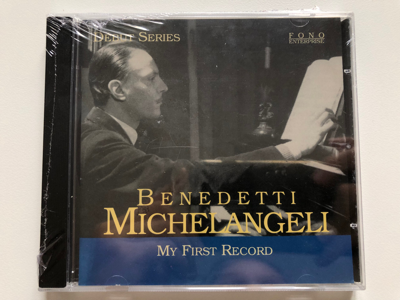 https://cdn10.bigcommerce.com/s-62bdpkt7pb/products/0/images/221311/Benedetti_Michelangeli_-_My_First_Record_Debut_Series_Fono_Enterprise_Audio_CD_2001_FONO_1026_1__11918.1649662553.1280.1280.JPG?c=2&_gl=1*teotp2*_ga*MjA2NTIxMjE2MC4xNTkwNTEyNTMy*_ga_WS2VZYPC6G*MTY0OTY1NzEzNy4zNTMuMS4xNjQ5NjYyMzE4LjM3