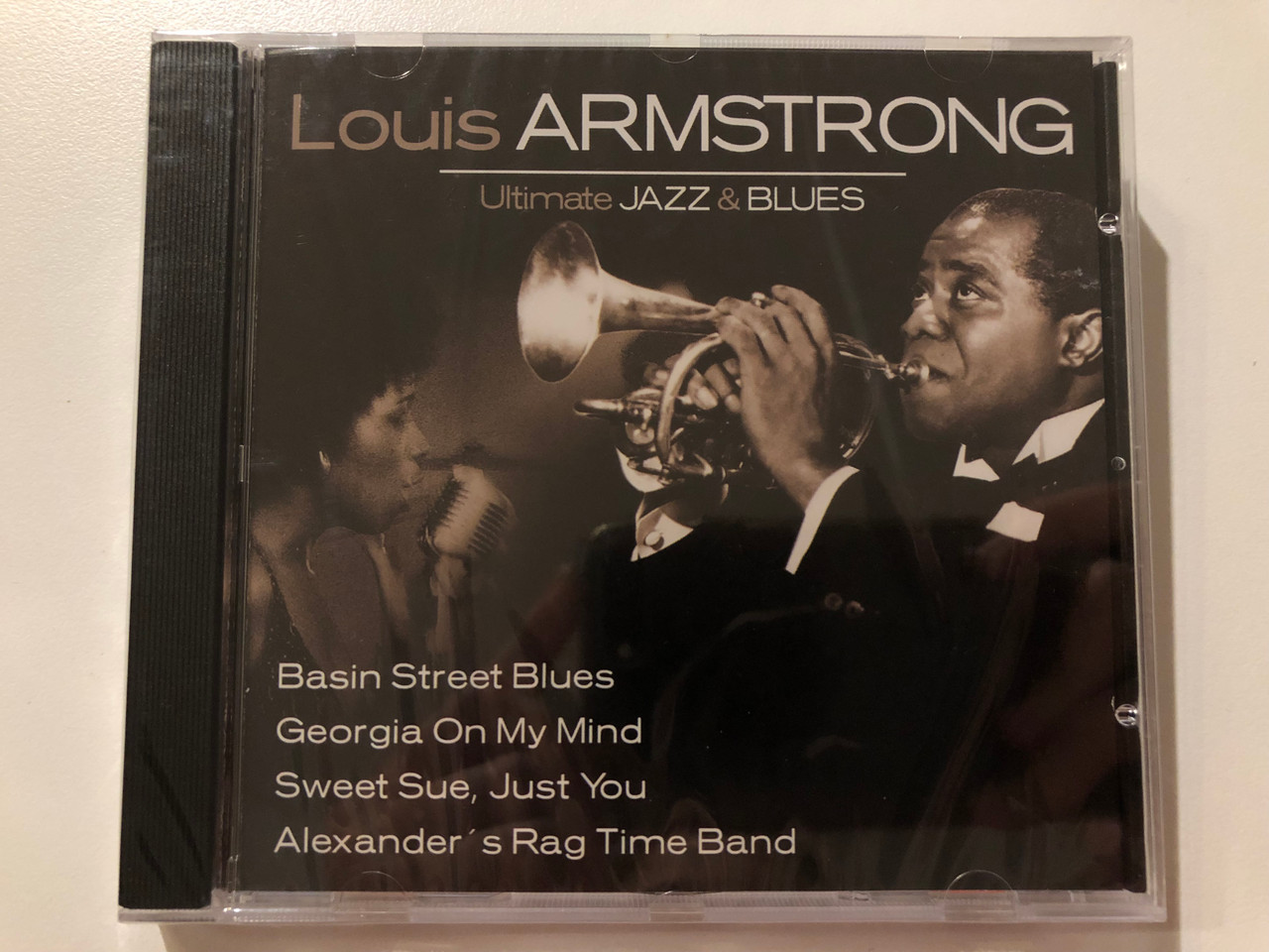 https://cdn10.bigcommerce.com/s-62bdpkt7pb/products/0/images/221345/Louis_Armstrong_Ultimate_Jazz_Blues_Basin_Street_Blues_Georgia_On_My_Mind_Sweet_Sue_Just_You_Alexanders_Rag_Time_Band_Weton-Wesgram_Audio_CD_2004_IECJ30001-24_1__68612.1649670219.1280.1280.JPG?c=2&_gl=1*uvfv0l*_ga*MjA2NTIxMjE2MC4xNTkwNTEyNTMy*_ga_WS2VZYPC6G*MTY0OTY1NzEzNy4zNTMuMS4xNjQ5NjY5ODQ5LjQy