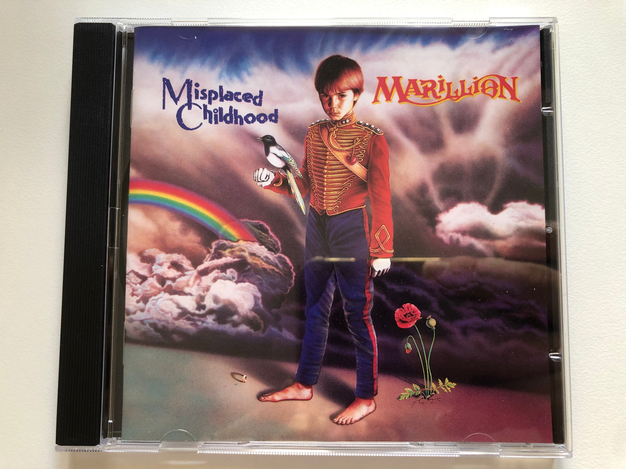 https://cdn10.bigcommerce.com/s-62bdpkt7pb/products/0/images/221839/Marillion_Misplaced_Childhood_EMI_Audio_CD_1995_077774616027_1__80739.1649858606.1280.1280.JPG?c=2&_gl=1*1cm8svd*_ga*MjA2NTIxMjE2MC4xNTkwNTEyNTMy*_ga_WS2VZYPC6G*MTY0OTg1ODIyMS4zNTUuMS4xNjQ5ODU4MzA3LjQ2