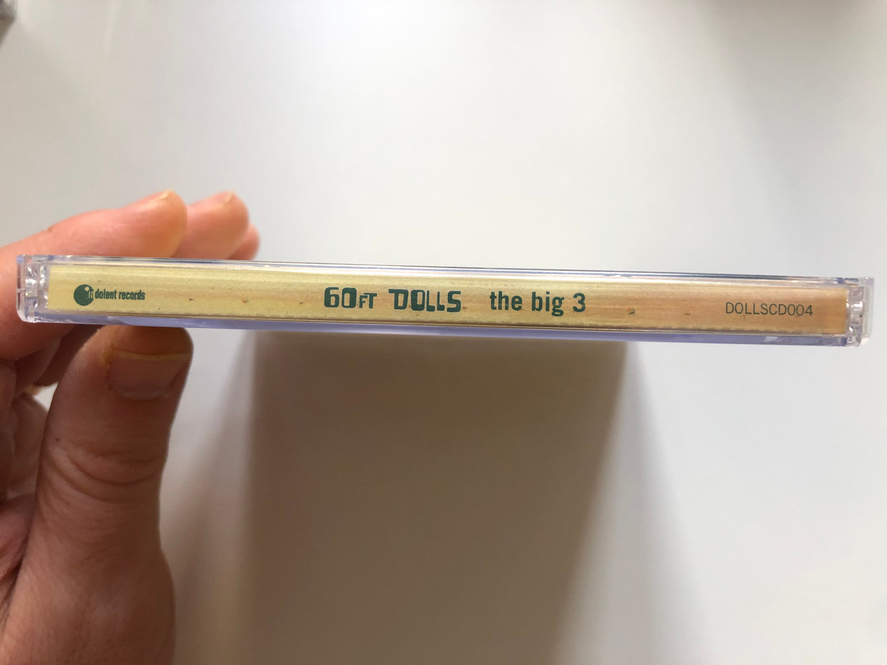 https://cdn10.bigcommerce.com/s-62bdpkt7pb/products/0/images/221877/60ft_Dolls_The_Big_3_Indolent_Records_Audio_CD_1996_DOLLSCD004_3__84075.1649861457.1280.1280.JPG?c=2&_gl=1*h7giq2*_ga*MjA2NTIxMjE2MC4xNTkwNTEyNTMy*_ga_WS2VZYPC6G*MTY0OTg1ODIyMS4zNTUuMS4xNjQ5ODYxMzY2LjUy