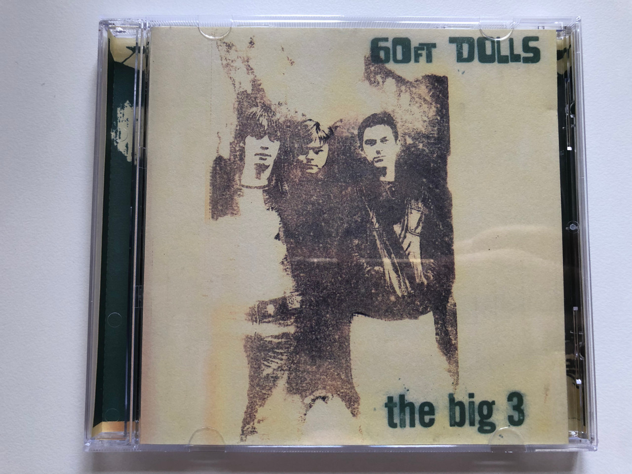 https://cdn10.bigcommerce.com/s-62bdpkt7pb/products/0/images/221878/60ft_Dolls_The_Big_3_Indolent_Records_Audio_CD_1996_DOLLSCD004_1__41166.1649861461.1280.1280.JPG?c=2&_gl=1*h7giq2*_ga*MjA2NTIxMjE2MC4xNTkwNTEyNTMy*_ga_WS2VZYPC6G*MTY0OTg1ODIyMS4zNTUuMS4xNjQ5ODYxMzY2LjUy