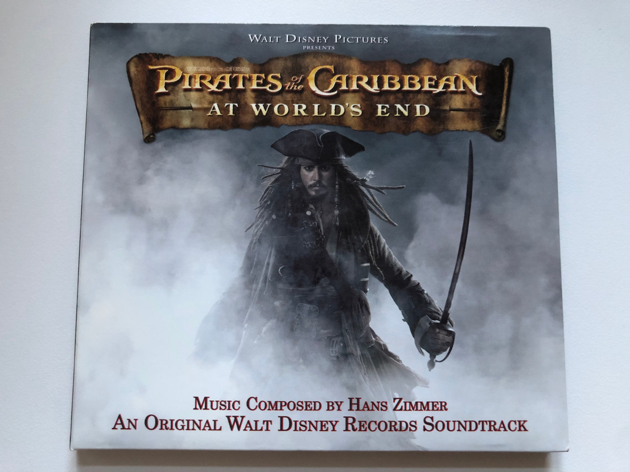 https://cdn10.bigcommerce.com/s-62bdpkt7pb/products/0/images/221935/Walt_Disney_Pictures_Presents_-_Pirates_Of_The_Caribbean_At_Worlds_End_Music_Composed_By_Hans_Zimmer_An_Original_Walt_Disney_Records_Soundtrack_Walt_Disney_Records_Audio_CD_2007_D00003710_1__33546.1649865994.1280.1280.JPG?c=2&_gl=1*1nplqna*_ga*MjA2NTIxMjE2MC4xNTkwNTEyNTMy*_ga_WS2VZYPC6G*MTY0OTg1ODIyMS4zNTUuMS4xNjQ5ODY1NzgwLjM3