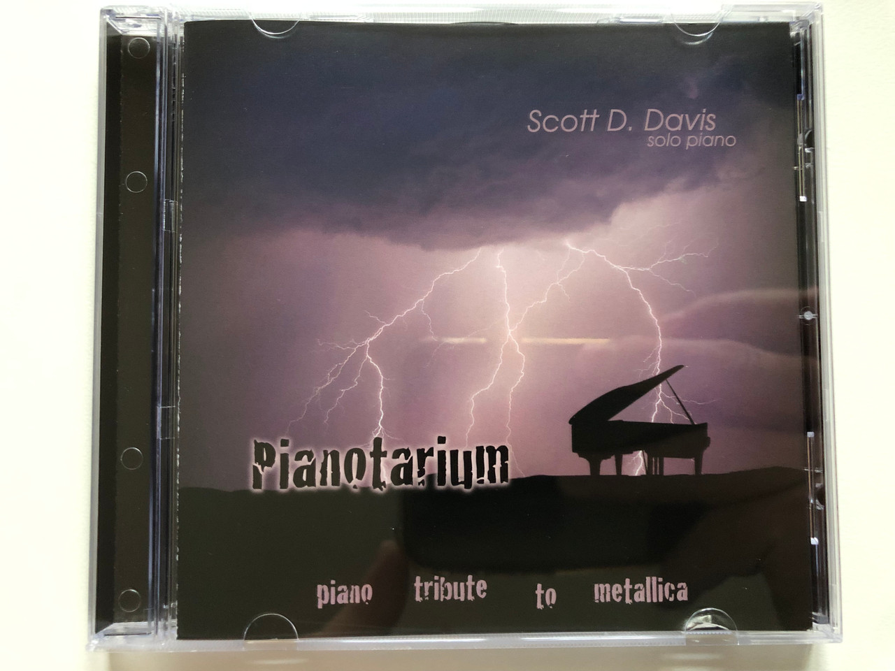 https://cdn10.bigcommerce.com/s-62bdpkt7pb/products/0/images/222015/Scott_D._Davis_solo_piano_Pianotarium_-_Piano_Tribute_To_Metallica_Scovis_Music_Productions_Audio_CD_2007_SDD005_1__57691.1649941838.1280.1280.JPG?c=2&_gl=1*1h2xqax*_ga*MjA2NTIxMjE2MC4xNTkwNTEyNTMy*_ga_WS2VZYPC6G*MTY0OTkzODE4Mi4zNTYuMS4xNjQ5OTQxNzQyLjUx